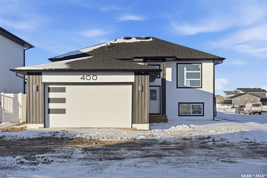 Welcome to 400 Eldorado St. located in the growing city of Warman & situated on a large corner lot with close proximity to parks, walking paths, the Warman BMX track, the skate park & ball diamonds.  This beautifully finished 1280 sq.ft bi-level style home with a double attached garage features separate entry into an unfinished basement that is set up for a future 2- bedroom legal suite!  The main floor has a large foyer with tiled floors, a seating area & closet for coats/boots.  The home has an open concept kitchen to living room & dining area.  The kitchen features tile backsplash, quartz countertops, Stainless steel appliances, a hood fan that vents directly outside & a large island.  The dining room walks out on to a large deck overlooking the future backyard.  The main floor also has a 4-piece bathroom, 3 good sized bedrooms with the primary bedroom having a 4-piece ensuite bathroom & a large walk-in closet.  The basement can be accessed from the main floor or separate side entrance.  It has the laundry area, mechanical room & it is unfinished ready for a future suite.  This home has Progressive new home warranty included & is built by Royal Choice Homes Ltd. with great attention to detail & quality finishes.  It comes complete with all appliances, washer, dryer, 2 electrical metres & an air exchanger.  There are options to have the basement finished or driveway included at additional cost – all work weather permitting.  GST/PST included in the purchase price with rebate to the builder. Call to view.