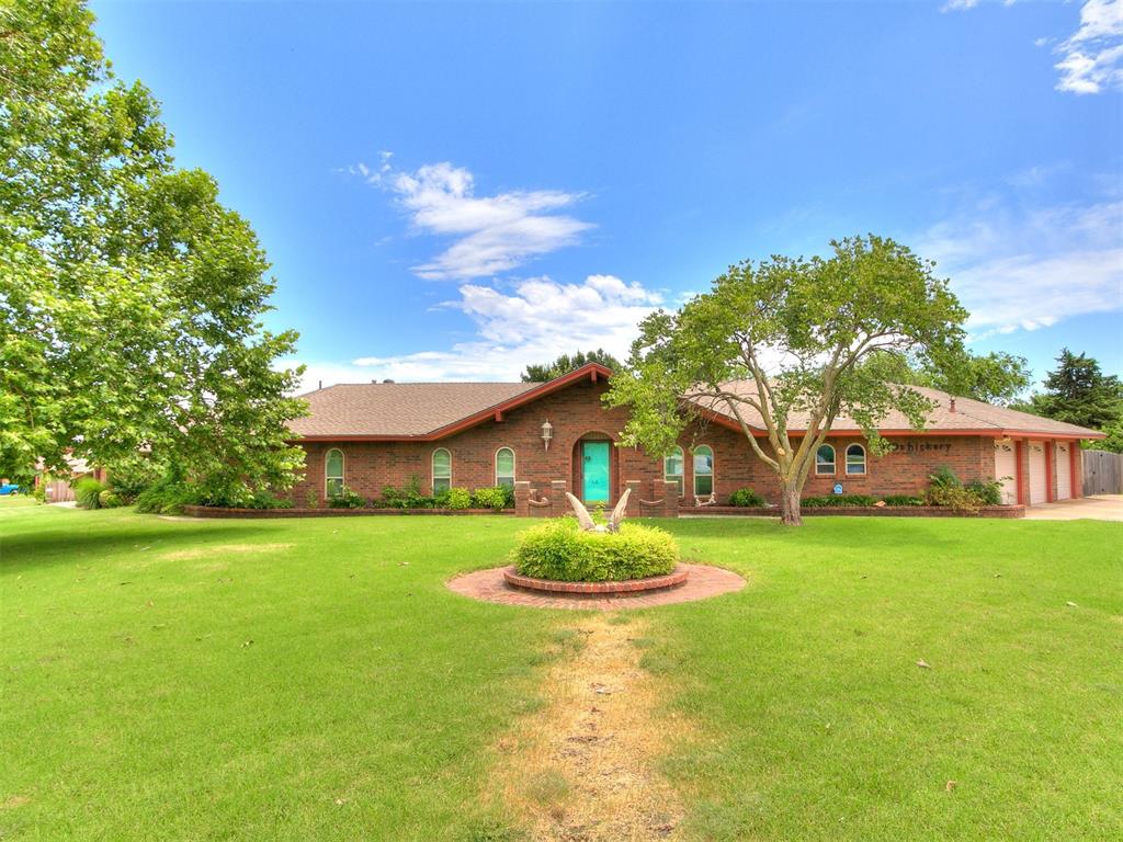 This beautifully well kept home is located in the heart of Moore Oklahoma, just a short walk from Veteran's Park and local top rated Moore public schools. Situated on an oversized corner lot with great access to a deep three car garage. Inside, find a perfect mixture of modern upgrades and classic traditional design! Upgrades include updated windows, brand new hot water tank and remodeled bathrooms. Next to the entry, there is a dedicated study/office area perfect for "work from home" or hobbies. Natural wood beams sit within a vaulted ceiling in the living room anchored by a Gas Fireplace and the presence of natural woodwork flows throughout the entire house. Adjacent to the large living room is a bonus room with dual closets or could be used as a fourth bedroom. The Kitchen and Dining room has loads of space for cooking and entertaining along with upgraded dishwasher, Gas Cooktop and built-in oven. On the other side of the home, find the remaining bedrooms and three full bathrooms. The guest bath has been recently updated with white marble everywhere and is sure to impress! The spacious Primary bedroom features dual closets and en-suite bathroom complete with walk-in shower. The two remaining bedrooms share a full bathroom outfitted in slate tile. The tree-lined backyard features a small Lily Pond and is a wonderful place to enjoy the Oklahoma evenings under the covered patio while the kids enjoy the swing set. The hot-tub stays with property! Inside the 3-car garage find loads of shelving along with an in-ground storm shelter. This home with its classical charm awaits your creativity and final touches! Welcome home!