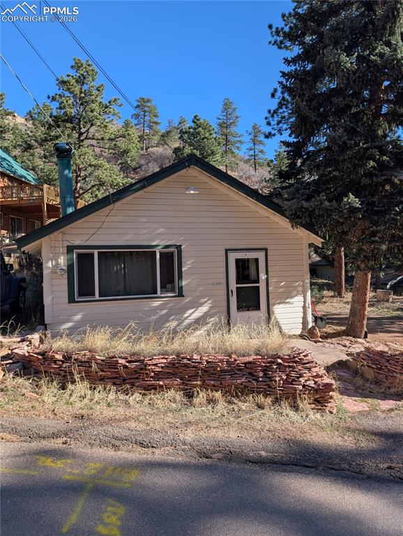 Green Mountain Falls home looking for owner wanting to put in sweat equity. This home is all about the location, set at the end of the street this home offers quiet mountain living at its best. This home has a main level bedroom and attic that can be used as a 2nd bedroom. Has off street parking on both sides of the home.. Includes newer gas range and refrigerator, On top of a brand new furnace, the home also has a wood burning stove that will heat the whole home all winter for a fraction of the cost. About 600 sq. ft.