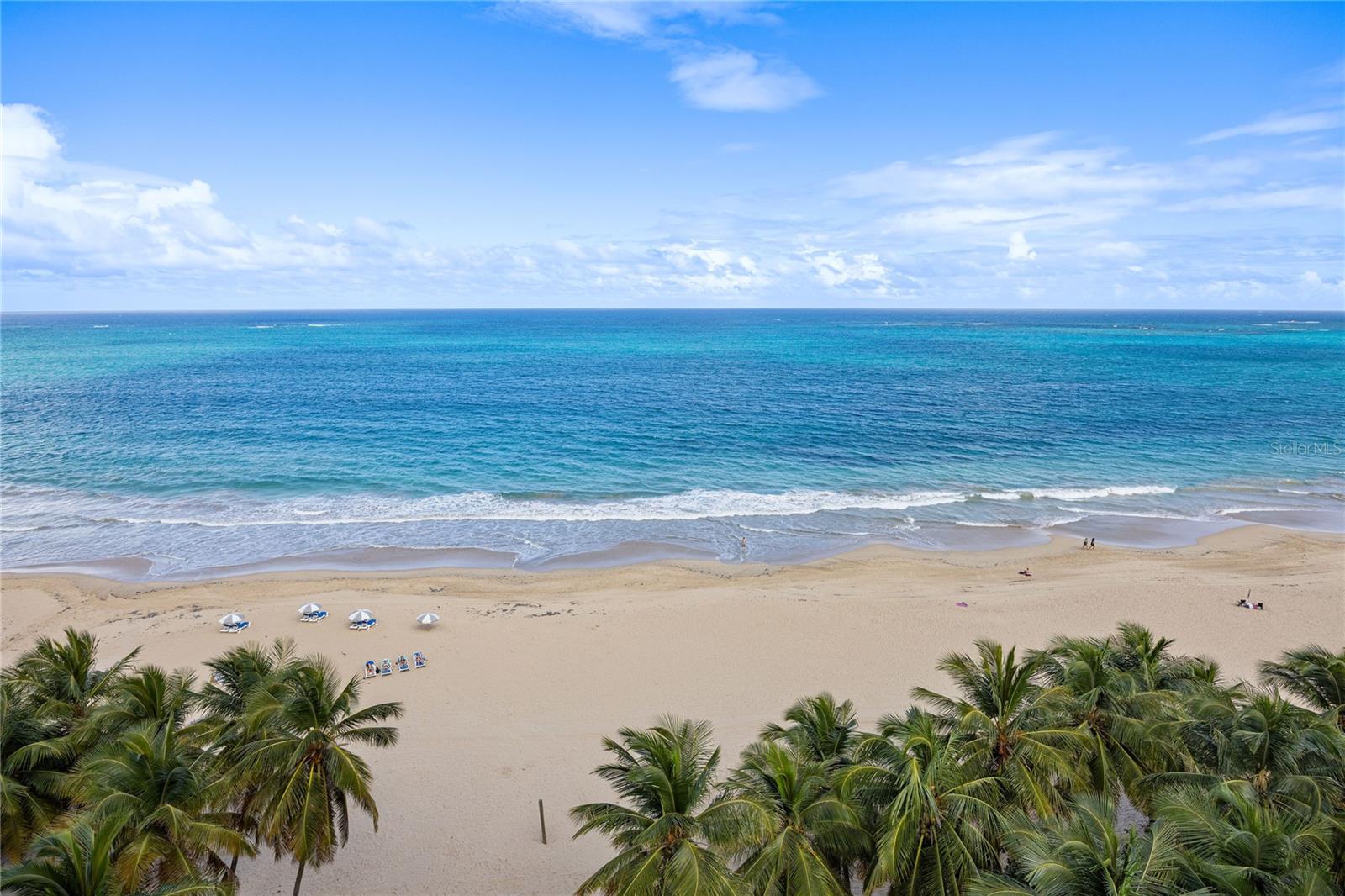 Discover a rare opportunity to own a high-floor oceanfront residence in one of the most sought-after and vibrant neighborhoods, where stunning northeastern ocean views take center stage.Flooded with natural light, the open-concept layout features two ensuite bedrooms and the flexibility to add a third. Marble floors throughout offer timeless elegance and natural cooling ideal for tropical living. Move right in and enjoy a brand-new kitchen and meticulously upgraded bathrooms. A private balcony is the perfect spot to unwind and take in the sunrise.The building opens directly onto Ocean Park Beach, a local favorite and protected turtle nesting site that also serves as a hub for beach tennis, volleyball, yoga, and more. Amenities include an on-site gym and two dedicated parking spaces, one covered and equipped with an EV charger.Pharmacies, banks, casual eateries, fine dining, and a 24/7 supermarket are all within walking distance, and Saint John’s School and Robinson School are just two blocks away, all in an area known for its welcoming community and lively atmosphere.HOA: $769.19/mo. | Property tax: $1,875.00/yr. | Hazard insurance: $7,166.72/yr.