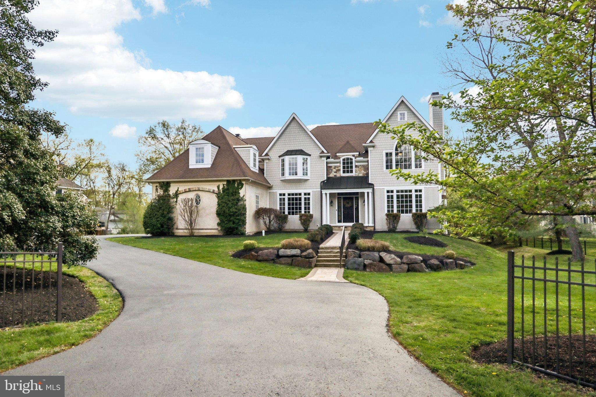Welcome to 486 Church Rd, a beautiful colonial home boasting 6 bedrooms, 6.2 bathrooms in the heart of Devon and within top ranked Tredyffrin-Easttown Schools. Sitting on a breathtaking 1+ acre lot, this home has been lovingly cared for and offers a ton of upgrades inside and out. As you enter the foyer, you are greeted by refinished hardwood flooring and extensive millwork that extends throughout the home. The formal living room offers a gas fireplace and french doors that lead to the handsome office with paneled walls and built-in bookcases while the formal dining room with attached butler’s pantry is large enough to host all your future gatherings. The gourmet kitchen with commercial grade appliances and island seating is perfect for the cook at heart. Extending from the kitchen is the breakfast room that exits to the composite deck with awning - perfect for al fresco dining. The family room with coffered ceiling, gas fireplace, and built-in entertainment center flows effortlessly from the kitchen area creating an open floor plan that allows everyone to stay connected. The first floor is completed with two powder rooms and a mudroom with built-in cubbies and access to the three car attached garage. The second floor offers a luxurious primary suite with dual walk-in closets, a sitting area with gas fireplace and an expansive marble bathroom with dual vanities, spa-like shower, and jacuzzi tub; 2 more ensuite bedrooms with walk-in closets; two additional bedrooms with walk-in closets that share a bathroom; and a fully equipped laundry room. The third level offers an additional ensuite bedroom with a private bathroom and walk-in closet. The finished, walk-out lower level offers something for everyone- a theater/entertainment area, a well appointed bar, a sound-proof music room, a gym/fitness area, and a full bathroom to rinse off after working out or swimming in the pool. The outside of this home is not to be missed and offers a stunning pool with attached hot-tub, waterfall fountains, a ton of patio space to enjoy the sun and an automatic, safety pool cover  - all while overlooking the beautiful grounds. This home is ideally located -close to major roadways for an easy commute and Paoli train station for a nonstop commute to NYC, minutes to some of the best private academies in the area including Episcopal Academy and Devon Prep, and close to the shopping/dining options of Lancaster Avenue, Wayne and KOP. Call today for more information; this property is not to be missed!