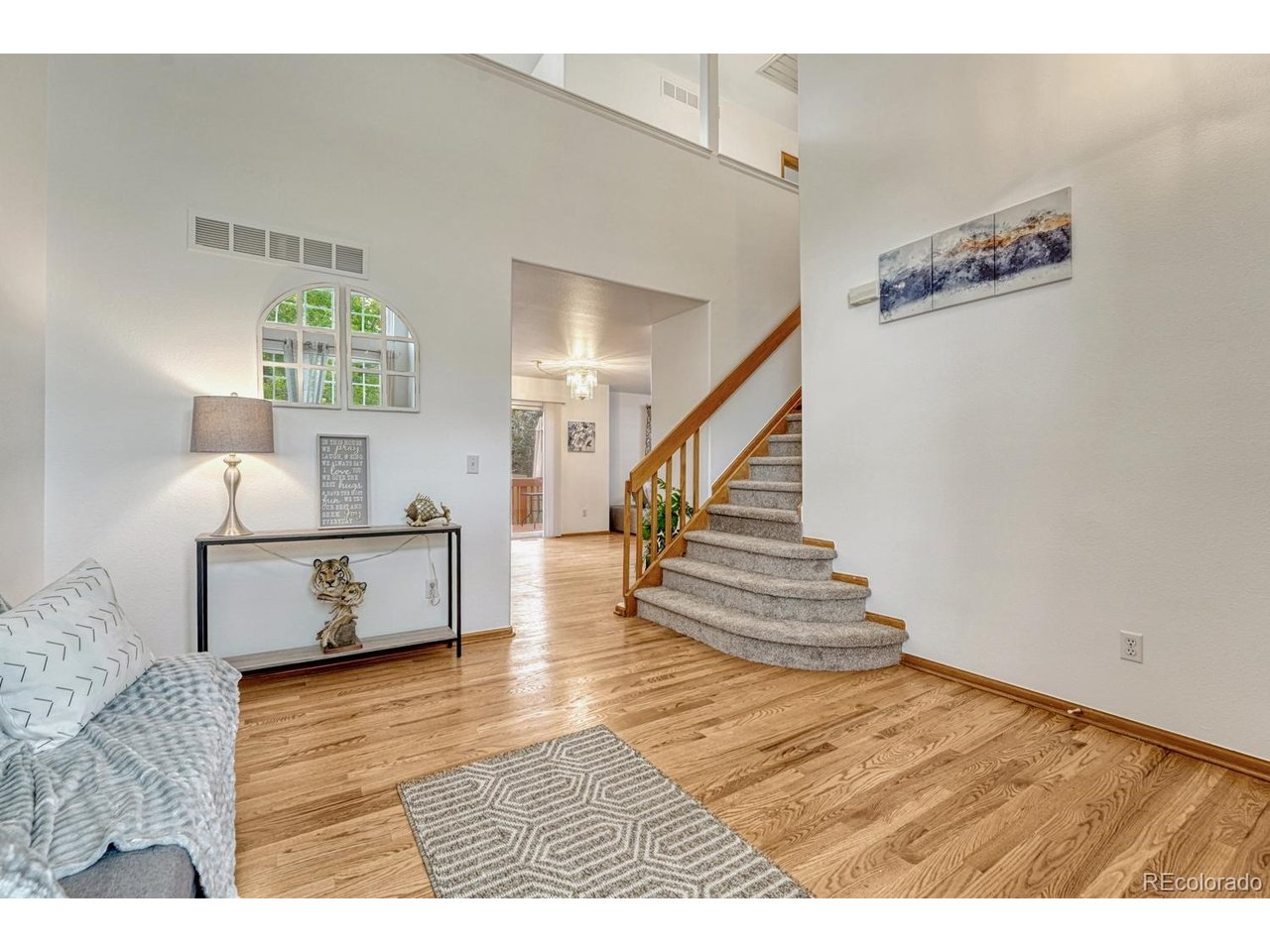 Sellers are motivated and ready to sell, and they are offering a generous $20,000 concession toward an interest-rate buydown.This beautifully maintained Richmond New Haven model has been thoughtfully updated inside and out. The home features brand-new interior paint, fresh exterior paint, new carpet, a new cooktop, and a new refrigerator, giving the home a refreshed and move-in-ready feel.The open floor plan welcomes you with hardwood floors in the entry, kitchen, and dining areas, along with stained woodwork, solid doors, and rounded corners throughout.The formal living room offers vaulted ceilings, while the open kitchen with island overlooks both the dining area and the spacious family room with a gas log fireplace. A main-floor laundry with a half bath adds convenience.Upstairs, the large primary suite includes a walk-in closet and a five-piece master bath. The bright, open loft provides flexible space and can easily be converted into a fourth bedroom if needed.Enjoy outdoor living on the 14' x 12' redwood deck, perfect for relaxing or entertaining. Additional features include a gas-forced air furnace with humidifier, central air conditioning, a whole-house fan, a programmable thermostat, and a fully insulated two-car garage.With thoughtful updates throughout and a $20,000 rate buydown incentive, this home offers exceptional value in a highly desirable community.