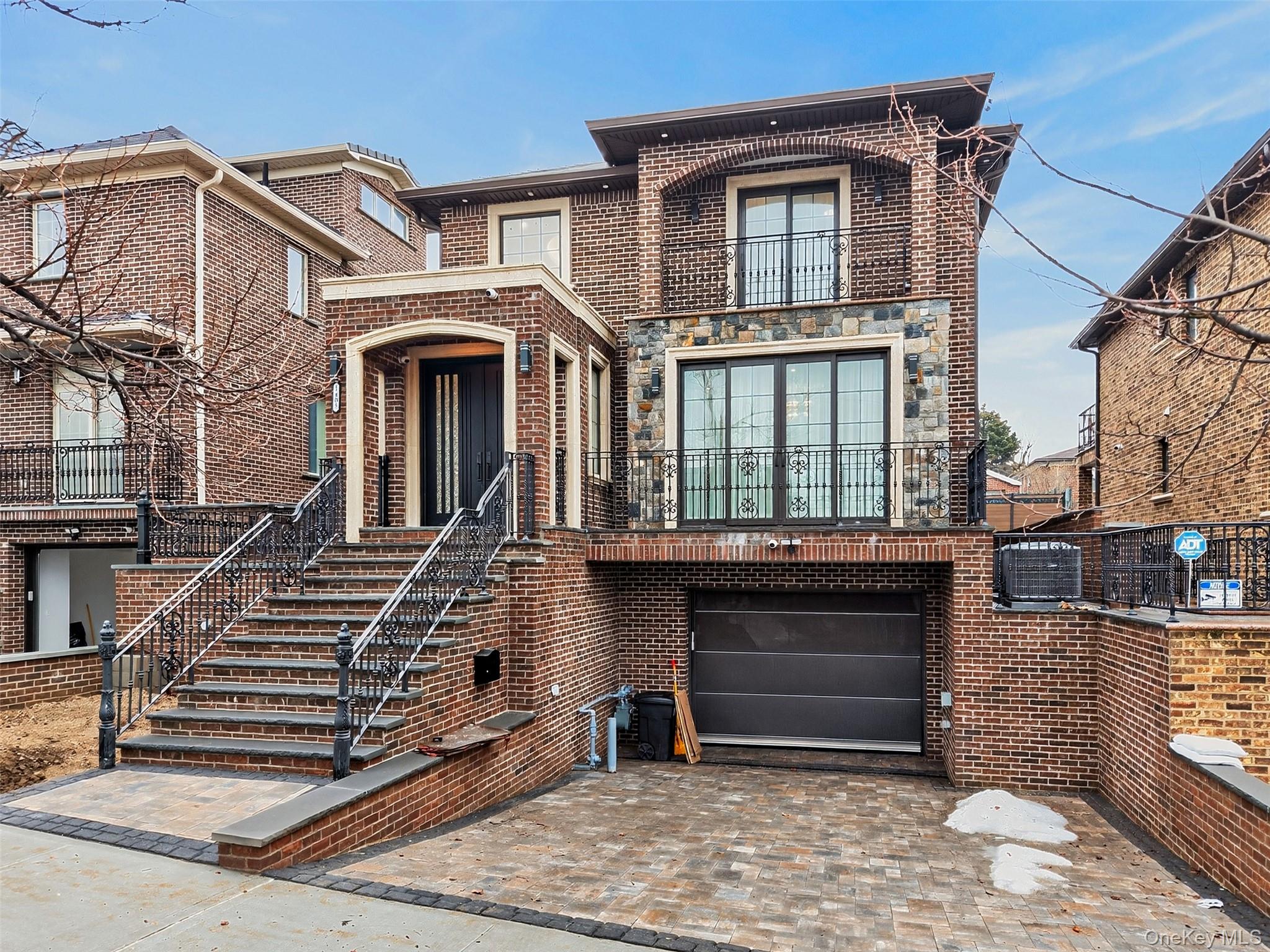 Brand New Luxury Home in the heart of College Point. Situated on an approximately 4,000sqft lot with about 2,500sqft of interior living space, this beautifully designed residence offers modern comfort, premium materials, and high-end craftsmanship throughout. The first-floor features spacious front and rear balconies, a bright living room, formal dining room, a modern open-concept kitchen, a family room, and one full bathroom. The entire level is finished with imported Italian tiles and radiant heated floors, providing both comfort and elegance. The second floor offers four generously sized bedrooms and two full bathrooms, complemented by warm hardwood flooring throughout. The high-ceiling basement boasts approximately 9-foot ceilings, tiled floors with radiant heating, a full bathroom, and a separate entrance, offering flexible space ideal for recreation, a home office, gym, or extended living use. Additional highlights include a 12-inch wood beam structure with full spray foam insulation for enhanced energy efficiency, premium Kohler shower systems, imported Italian tiles, and Pella high-end windows with oversized sliding glass doors that allow for abundant natural light. The home is also equipped with Samsung smart appliances including a double-wall steam oven, air fryer, and microwave combination with WiFi capability. Attached garage plus driveway parking for up to two additional vehicles. A perfect blend of modern luxury, smart technology, and quality construction in a desirable College Point location.