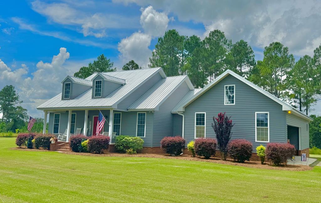 Discover the perfect blend of tranquility and modern living in this charming 1,870 sq. ft. home three bedroom two bath, nestled in the peaceful countryside of Moultrie, Georgia.  Newly installed Air conditioning in 2024 and roof was replaced in 2019. As you step inside, you'll be greeted by an open foyer and a pitched ceiling living room. Great space for entertaining guests. The kitchen boasts an island with additional storage, perfect for meal prep or casual dining, and a window that offers a picturesque view of the backyard. This home also features large laundry room equipped with built-in cabinets. This newly listed property offers a spacious master bedroom with the potential for a fourth bedroom or a convenient office space if you don't need a second dining area. The exterior has a beautiful back wraparound porch great for family gatherings. Enjoy the serenity of country living with stunning natural landscape views surrounding your new home. Whether you're starting a family, looking for a peaceful retreat, or wanting a home office, this property is ready for you to move in and create lasting memories. Schedule your viewing today!