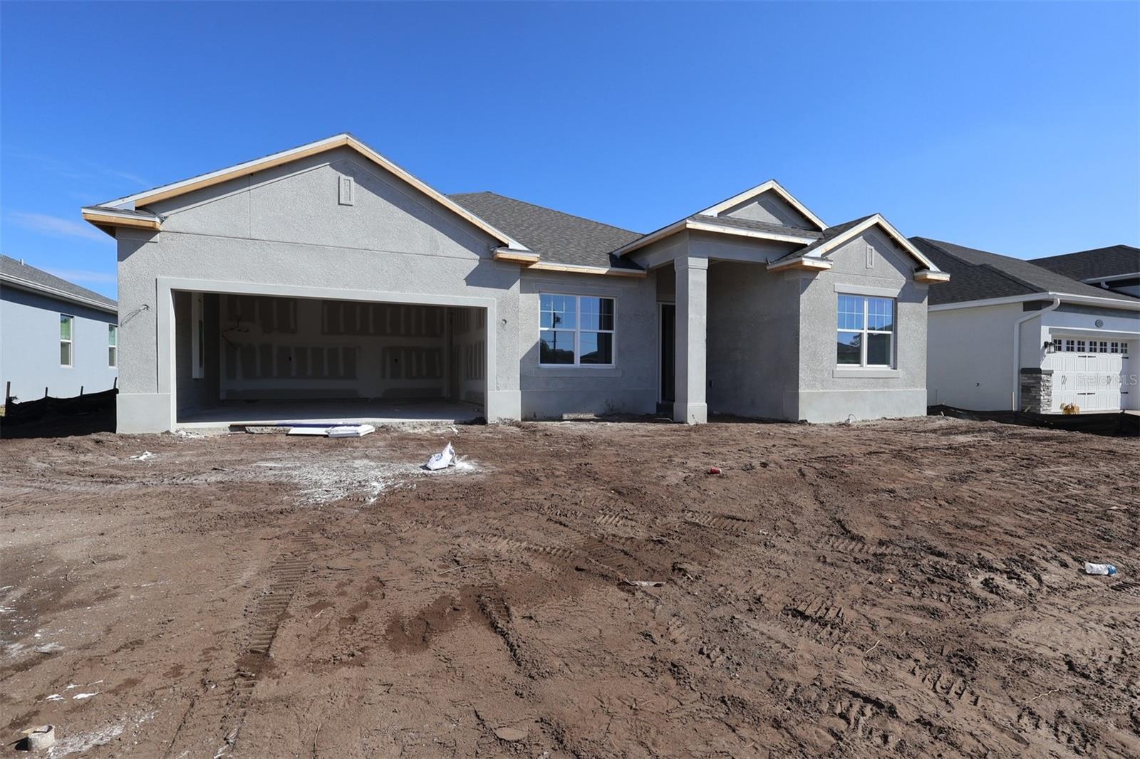 Under Construction. This new construction home at 2711 Ravencliffe Terrace in Oviedo offers 2,531 square feet of thoughtfully designed living space. Built by M/I Homes, this 4-bedroom, 3-bathroom home features an open-concept living space that creates seamless flow between the main gathering areas.As you enter through the front door, there is a versatile flex room, a laundry room, and a hallway to the 2-car garage on your left; on the right side are two bedrooms with a Jack-and-Jill bathroom. Continue to the open-concept heart of this home, where the kitchen, dining areas, and living room flow together to create an inviting atmosphere for daily life and entertaining. The kitchen features a large island and loads of cabinets and countertop space.Flexible enough to have formal and informal areas, the living room area provides plenty of space, oversized windows, and sliding doors to the lanai. A hallway adjacent to the informal dining room leads to the fourth bedroom and third bathroom.Your owner's suite is located in the corner of this home and features a large walk-in closet and an en-suite bathrooms with dual sinks, a linen closet, and a separate shower and soaker tub.