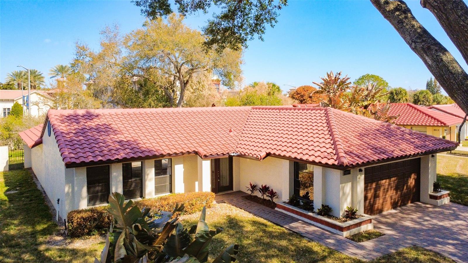 Welcome to your dream pool home! This beautiful 2 Bedroom 2 Bathroom Single Family Pool Home is located in Granada Villas in Dr Phillips and has completely been renovated with New Flooring, New Kitchen, New Bathrooms, New Roof installed in 2025, New Hot Water Heater installed in 2025 and More. Enjoy the Large living room with vaulted ceilings and Travertine Floors, offering plenty of space for entertaining or relaxing. With views of the large front yard and Pool area. Access the amazing backyard from every room. The Backyard features a screened in pool, covered patio and a large fully fenced in Yard.  Fully updated Kitchen with cabinets, appliances and granite countertops. The split-bedroom floor plan offers privacy for the primary bedroom suite and guest bedroom both with updated attached Bathrooms and walk in closets. Granada Villas offers amenities and a location that can’t be beat. The HOA provides individual lawn care including cutting, fertilizing, watering, irrigation system maintenance, landscape trimming & tree pruning. The lakeside gated recreation area features 2 tennis courts, and a boat ramp with access to Little Sand Lake. Only minutes away to restaurants, shops, grocery stores, coffee shops, banks Universal Studios, Sea World and Disney World, International Drive. Easy access to the Orlando International Airport, downtown Orlando.