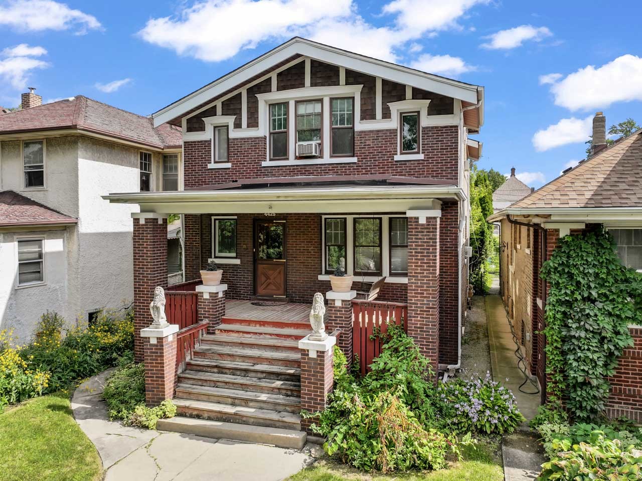 Charming Solid-Brick Two-Story on a Beautiful Tree-Lined Street! This classic two-story brick home is filled with timeless character, from the hardwood floors throughout to the original crown and base molding. A welcoming covered front porch offers plenty of space for chairs or even a swinging bench-the perfect spot to relax and watch the neighborhood go by. Step inside the foyer and you'll immediately notice the rich original woodwork and striking stained-glass windows that highlight the home's historic detail. The living room features built-in accent shelving to showcase your favorite pieces, while the adjoining dining room includes a built-in china hutch for both storage and display. The kitchen, remodeled in the 1990s, offers 36" cabinets with crown molding, an electric cooktop, wall oven, dishwasher, and a spacious walk-in pantry. A main-floor bedroom/den with large windows overlooks the backyard, providing a bright and inviting space. Upstairs, the front bedroom boasts two walk-in closets, the middle bedroom sits conveniently across from the full bath, and the back bedroom includes a ceiling fan, walk-in closet, and access to a private balcony-ideal for enjoying your morning coffee or evening glass of wine. Outside, a detached two-car garage is accessible from the alley. This home is being sold as-is, offering a wonderful opportunity to make it your own while preserving its classic charm. Property being sold as-is.