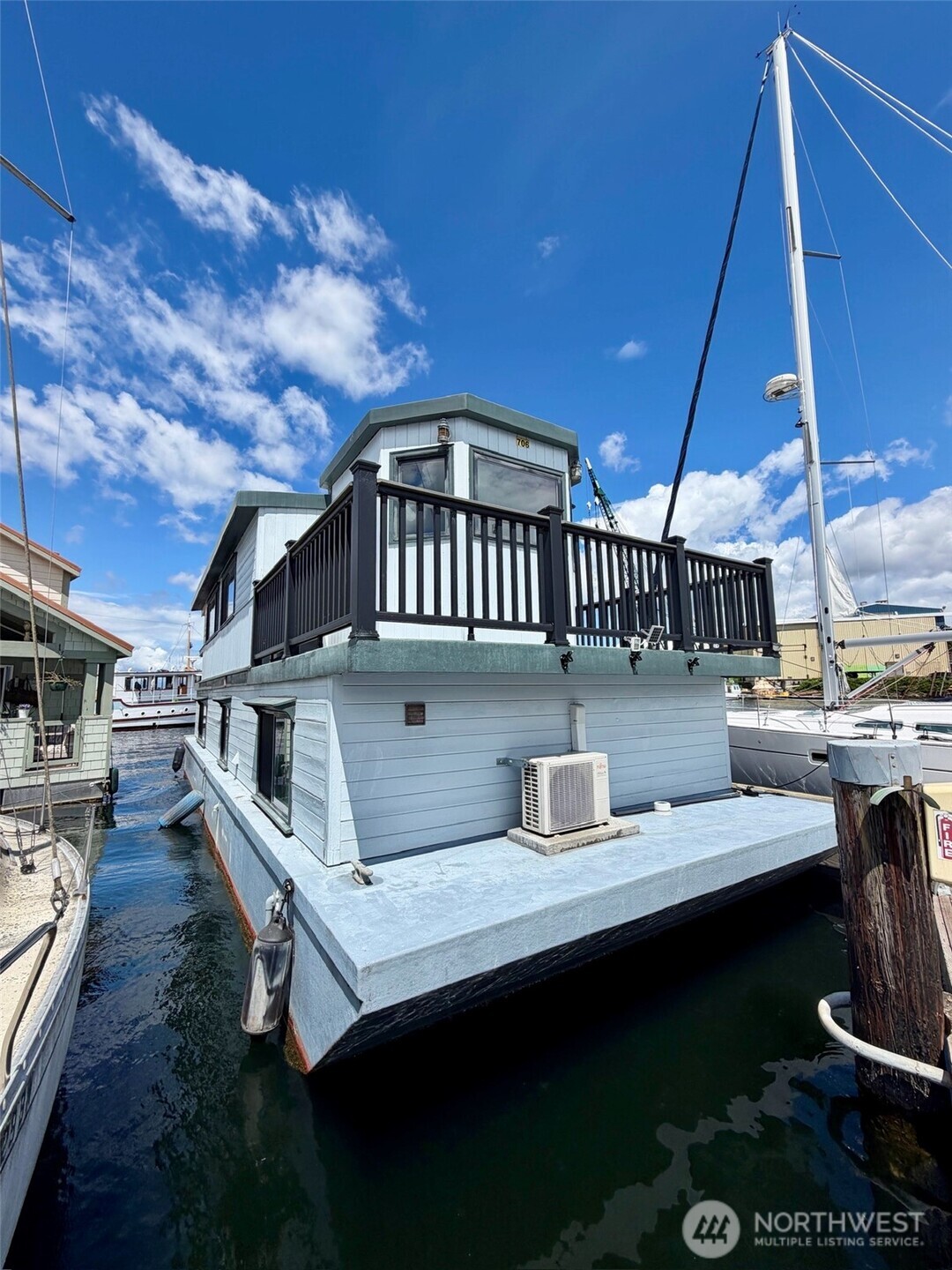 Stunning craftsmanship and liveability in a 48X16 floating home built by an English shipwright.  Built with tradition by marine tradesmen, there are no plastics or cheap quality materials; Enjoy solid custom made mahogany, cedar and oak interior made with old world craftsmanship and beautiful design. Meticulously maintained.  Two bedrooms and 0.75 bath at water level for stability. Ample closet and storage space. Large dining, living and kitchen spaces above with fore and aft decks to take in the marine sights and sounds as they go by your door. The desirable Ship Canal slip and liveaboard status are transferrable.  An authentic build with maritime tradition that is a significant part of the material culture of this region.    Monthly moorage fee is $930/month (including water, sewer, garbage, and Wi-Fi), plus $200 liveaboard fee though details are subject to a new marina agreement.    The roof is FRP (Fiber-Reinforced Plastic). Floating Home Loan might be available for financing.