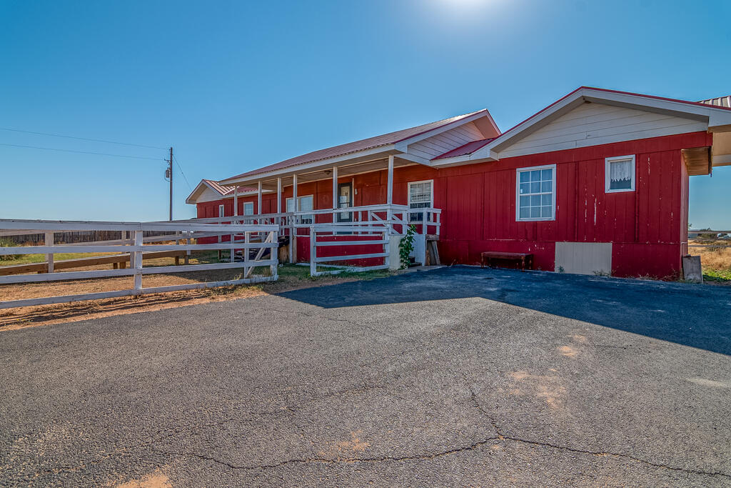 Bring Your Vision to Life in the Country! Discover the possibilities at 1011 N County Rd 1105, situated on 5.96 acres with room to spread out and enjoy country living. This 4-bedroom, 3-bath home offers 1,678 sq. ft. of space, plus front and back porches perfect for enjoying the outdoors. With two storage buildings and fencing and cross-fencing for cattle, this property offers a great foundation for your country dream. Ready for some TLC, this fixer-upper is a wonderful opportunity to add your personal touch and make it your own! Priced to sell and being sold AS-IS.