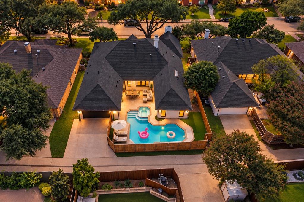 Beautifully reimagined in 2026, this stunning 4-bedroom, 3-bathroom home with a dedicated office and 2 spacious living areas offers 3,115 SF of luxurious living space on a 0.19-acre lot in Preston Highlands, one of Far North Dallas’ most desirable neighborhoods. This home truly checks all the boxes with soaring ceilings, elegant architectural arches, an incredible split-bedroom floor plan, abundant natural light, and a resort-style backyard with a heated pool and spa. Extensively renovated with designer finishes, major upgrades include a new roof, new HVAC, new doors & windows, 3 new designer baths & more! The impressive main living room features high ceilings with exposed beams and a statement gas fireplace finished in custom lime-washed plaster, complemented by premium engineered hardwood flooring and designer lighting throughout. The showstopping chef’s kitchen boasts custom cabinetry, a 9-foot quartz waterfall island, double wine cooler, 5-burner gas cooktop with pot filler, and an oversized walk-in pantry. Brand-new 8-foot glass sliding doors open to the covered patio, creating seamless indoor-outdoor living. A second living area with its own fireplace sits adjacent to the dedicated office with custom iron-and-glass doors. The luxurious primary suite overlooks the pool and features a spa-inspired bathroom with a custom double vanity, an impressive wet room with Bedrosians, Terrazzo, and Zellige tile, a walk-in shower, and a freestanding soaking tub. Two secondary bedrooms share a beautifully redesigned Jack-and-Jill bath, while the 4th bedroom has access to a separate full bathroom. Outside, enjoy your private backyard oasis featuring a heated pool & spa, covered patio, artificial turf, new privacy fence, and refreshed landscaping. Ideally located near Plano ISD schools, major hwys, Preston Road amenities, parks, and premier shopping and dining, this home offers the perfect combination of luxury, comfort, and convenience. Schedule your private tour today!