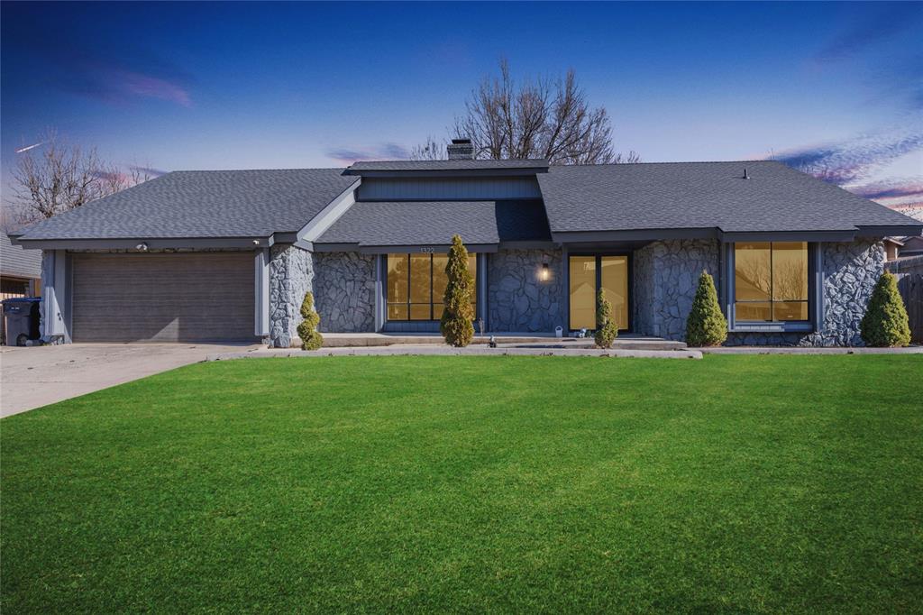 Featuring a brand-new roof replaced in 2025, this beautifully maintained 4-bedroom, 3-bathroom home in a fantastic NW OKC location offers 2,555 square feet of functional living space. The open floor plan is ideal for entertaining, featuring a formal living area off the entry and a larger main living space that boasts a cozy corner brick fireplace and a built-in wet bar perfect for a pool table or formal dining. The chef's kitchen showcases unique penny-tiled flooring, a pot filler over the gas stove, a large stainless steel farmhouse sink, and a casual dining nook. The spacious primary suite is a true spa-like retreat with a large soaker tub, dual vanities, hexagon tiled flooring, and a floor-to-ceiling tiled walk-in shower leading to a large closet. Outside, enjoy the large, fenced backyard with an open deck, and rest easy knowing the property is move-in ready.