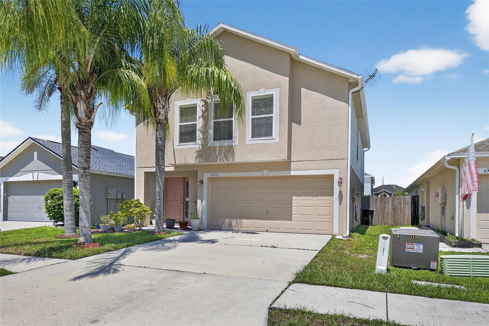 Welcome to 7510 Tabogi Trail in the sought after Chapel Pines community of Wesley Chapel! This beautifully updated 4 bedroom, 2.5 bathroom home offers 1,944 sq. ft. of living space designed for comfort and style. Step inside to find a spacious living room with tile floors, a ceiling fan, and a charming transom window, all open to the upgraded kitchen and dining area. The kitchen shines with oak cabinets, granite countertops, tile backsplash, stainless steel appliances, and a large pantry, plus a functional island with seating and deep drawers perfect for pots and appliances. The primary suite is a true retreat featuring vaulted ceilings, dual closets, and a renovated bathroom with stone counters, rain shower head, and modern finishes. Three additional bedrooms offer carpet, ceiling fans, and plenty of space for family, guests, or an office. Major upgrades include a 2022 roof, 2024 A/C, 2022 water softener, fresh 2025 interior paint, and renovated bathrooms. The smart garage door opener, generator-ready panel, gutters, pest control, and Brinks security system add peace of mind. Outdoor living is a breeze with a fully fenced yard with trees and the greenest of grass.  The home also features a spacious garage with storage shelves and foam-insulated panels to keep things cool. Located in a friendly neighborhood with easy access to schools, shopping, and dining, this move-in-ready gem is waiting for its next owner. The community HOA offers a well kept community feel with beautiful playground and park plus miles of sidewalks throughout the community.  This is Wesley Chapel living at its best.