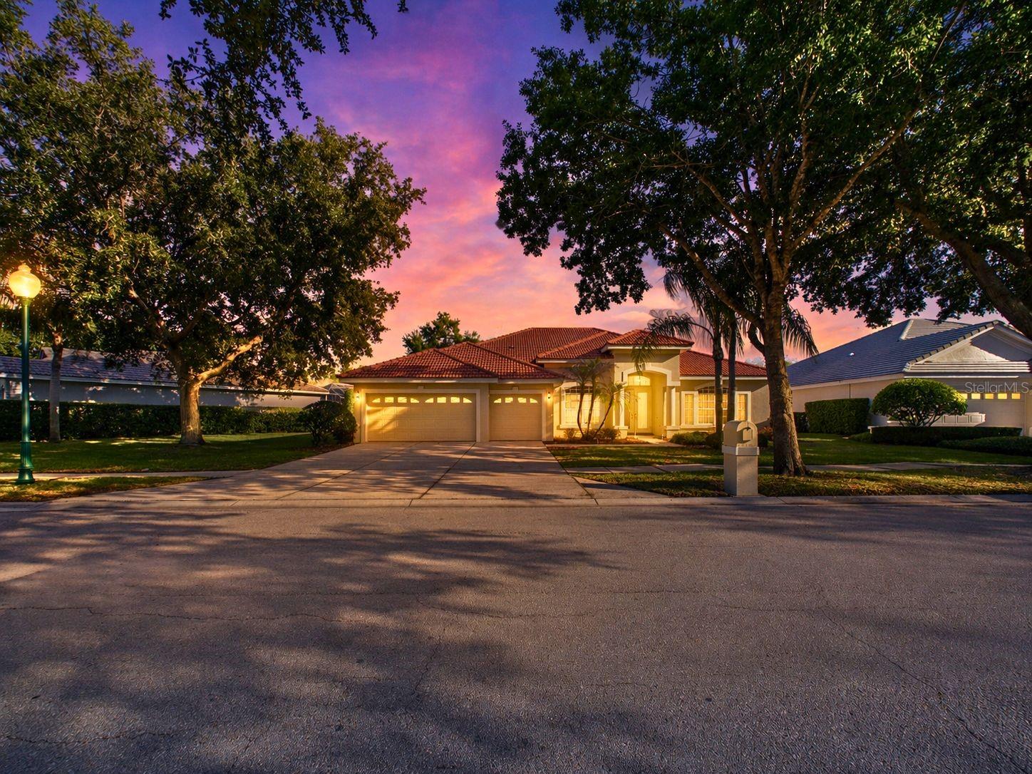 Don't miss this classic Arthur Rutenberg-built residence tucked inside the Estuary, a private gated enclave within the guard-gated Arbor Greene community in New Tampa. Offering 4 bedrooms, 4 full baths, and over 3,100 sq ft of single-story living, this home blends timeless construction with a highly functional, split-bedroom layout and seamless indoor/outdoor design.Set on a ~10,080 sq ft homesite with pond views, the property delivers a private outdoor experience anchored by a screened pool and spa with an oversized pool deck and outdoor kitchen that is ideal for entertaining or quiet evenings overlooking the water. Pocket sliding glass doors extend the living space outdoors, creating true Florida-style indoor/outdoor living.Inside, soaring ceilings and 8-foot doors enhance volume and flow throughout the home. The central kitchen opens to the main living area and features solid wood cabinetry, Corian countertops, and new stainless steel appliances, with a layout designed for both everyday use and hosting.The split floor plan offers privacy and flexibility. The primary suite includes a spacious footprint with direct pool access, while secondary bedrooms are thoughtfully designed—two with en-suite baths and walk-in closets, plus a dedicated pool bath for guests. A bonus/craft room adds versatility for hobbies, office, or flex use.Additional highlights include tile and engineered hardwood flooring throughout (no carpet), a tile roof, 3-car garage, and concrete pool/spa construction. Built in 2002 with enduring quality and maintained within one of Tampa’s established master-planned communities.Arbor Greene offers guard-gated entry, community clubhouse, resort-style pools, tennis courts, parks, and walking trails, with convenient access to I-75, USF, Wiregrass, and area hospitals.