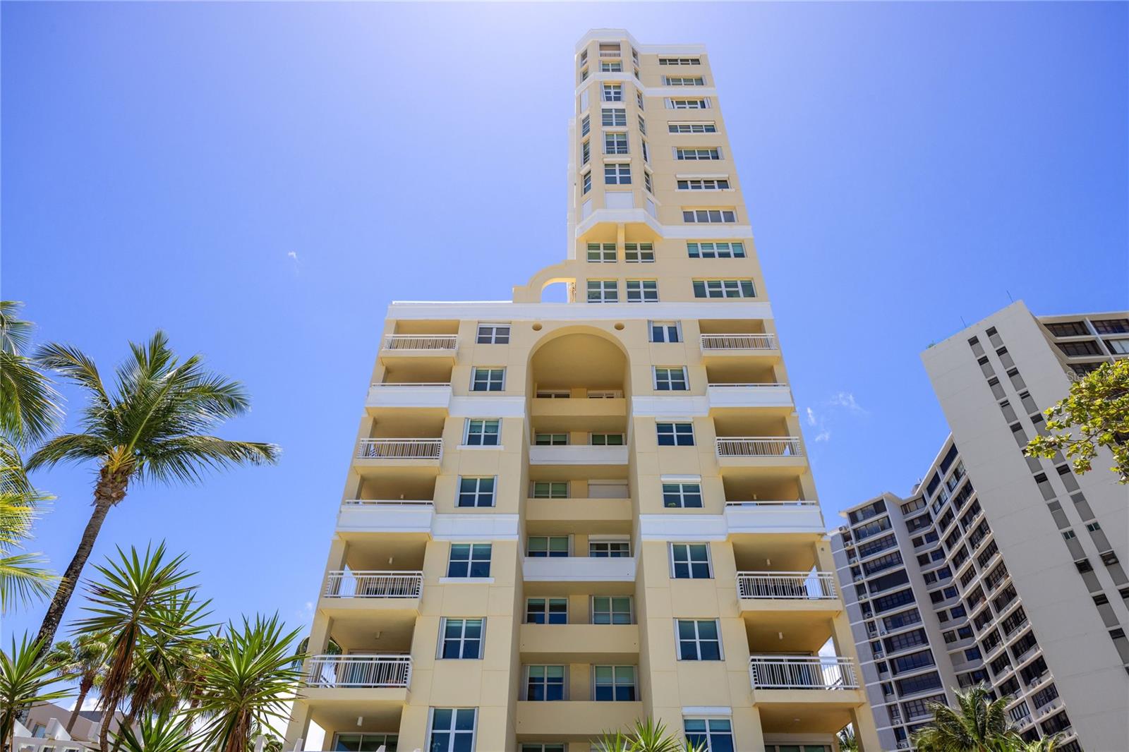 One or more photo(s) has been virtually staged. Perched on the 15th floor of the beachfront Carrion Court Playa Condominium, this exceptional residence showcases breathtaking ocean views throughout the home. Ideally located on the highly sought-after, gated street of Carrion Court, the property offers both privacy and prime beachfront living.Spanning approximately 1,591 square feet, the apartment features 3 bedrooms and 2.5 bathrooms, thoughtfully distributed for both comfort and functionality. The open-concept living and dining areas seamlessly extend to a spacious balcony, creating the perfect setting to enjoy panoramic ocean vistas and coastal breezes.The enclosed kitchen is conveniently positioned adjacent to the living areas and offers direct access to the balcony—ideal for both everyday living and entertaining. Elegant marble flooring and refined lighting fixtures add an elevated touch throughout the residence.All bedrooms are enhanced with custom-designed closets featuring automated lighting. The unit has also been upgraded with new hurricane-resistant windows and balcony doors.Carrion Court Playa is uniquely situated on the only gated street in the area and offers a full suite of premium amenities, including 24/7 security, dual full-capacity backup generators, a water cistern, heated pool, a playground, fitness center, activity room, and conference room. Residents enjoy direct beach access, providing a true coastal lifestyle—whether it’s morning walks along the shore, swimming in the ocean, or simply relaxing by the water.The unit has 2 designated parking spaces.