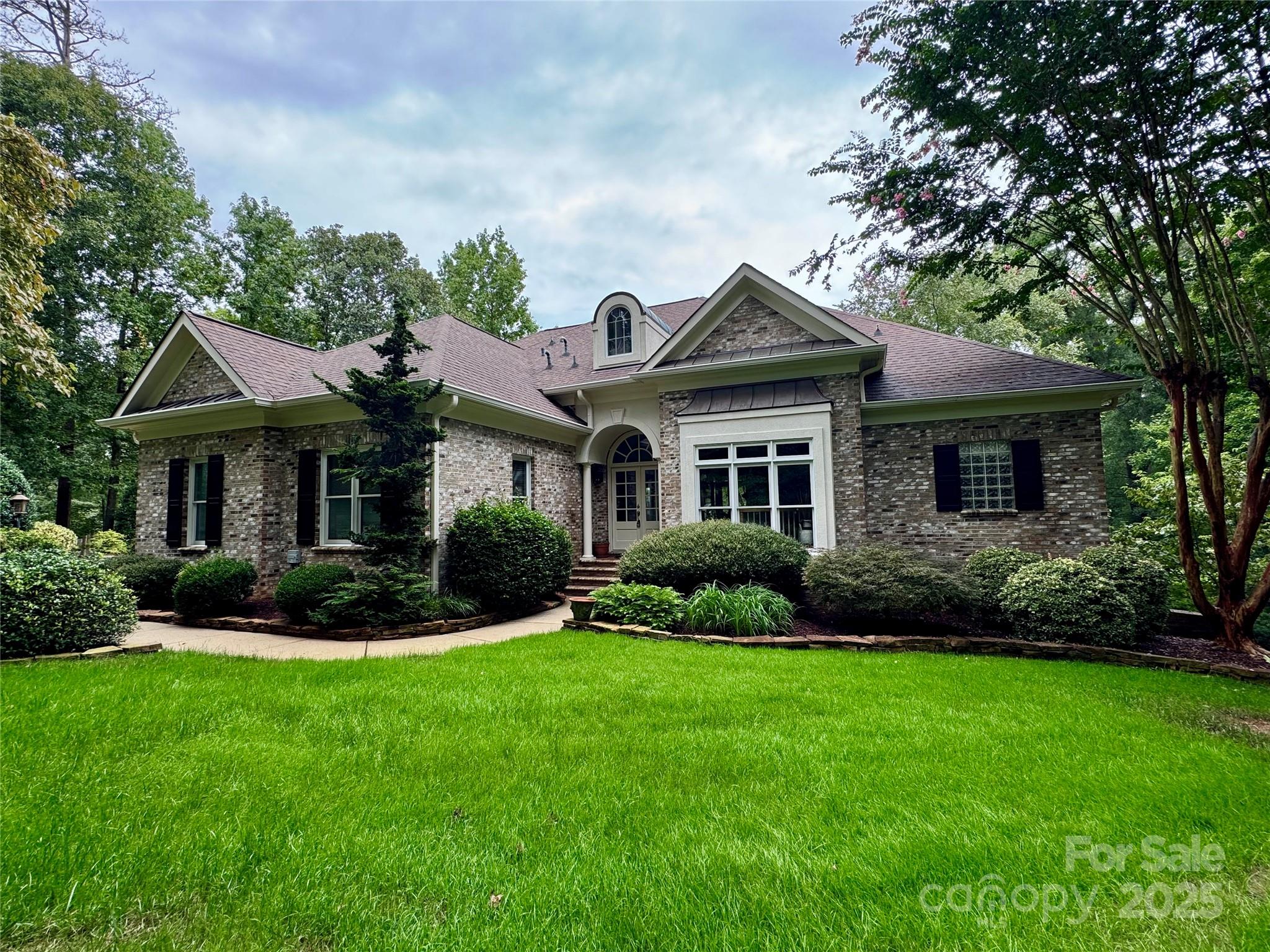 Nestled on the 6th green of The Old North State Club, 117 Whitley Mill Lane is a true gem. The home sits nicely on the lot, boasts long views of the golf course & the entertaining space can't be beat! Great outdoor space on both levels surrounded by mature. lush landscaping. The inviting Great Room with formal dining space off the kitchen makes for easy entertaining when hosting a crowd. Open kitchen boasts double ovens, great counterspace, breakfast nook and keeping room. Luxurious owner's suite with custom tray ceiling leads to a spacious bath & his & hers walk-in closets. Amazing living space on the lower level as well, which includes a stone fireplace that can be enjoyed from the bar area & cozy den. Two additional beds/baths and large study on the lower level. Join the Old North State Club and enjoy a full-service marina, dining, fitness, tennis/pickleball, pools & more. It's hard to believe it is just an hour's drive from Charlotte, the Triad & just a bit further from Raleigh.