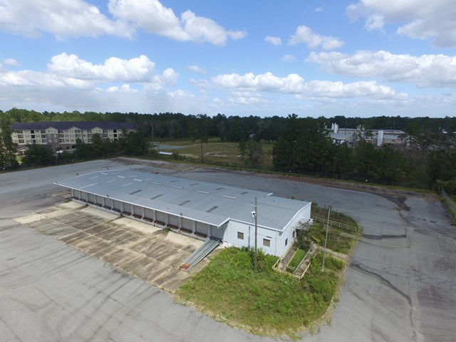 Looking for a site for RV/Boat/Equipment Storage or Truck  Terminal?  This property could be it!  Good looking, functional  Cross Dock Terminal / Hub.  31 Docks.  Office area around 1,000 sq ft with Dispatch, Sales Manager, Facility Manager Offices. Wired Maintenance Garage and Wired, Secured to Ground, Storage Drop-Offs.  5 Acres completely fenced and paved.  Employee Parking 22+/- Spaces including Handicap.  Convenient to By-Pass and US Hwy 319.   16' Walls ...Ceiling Higher.   Portable Docking Ramp.    Property in Good Shape.  Perimeter Security Fenced with Excellent lighting.  Good Area.    Area and Location would work well for Multi-Transitional Use.  CHA Per Tax Records.  Property has been vacant for a while.  Consider cost to reproduce all that is on this 5.5 acres.