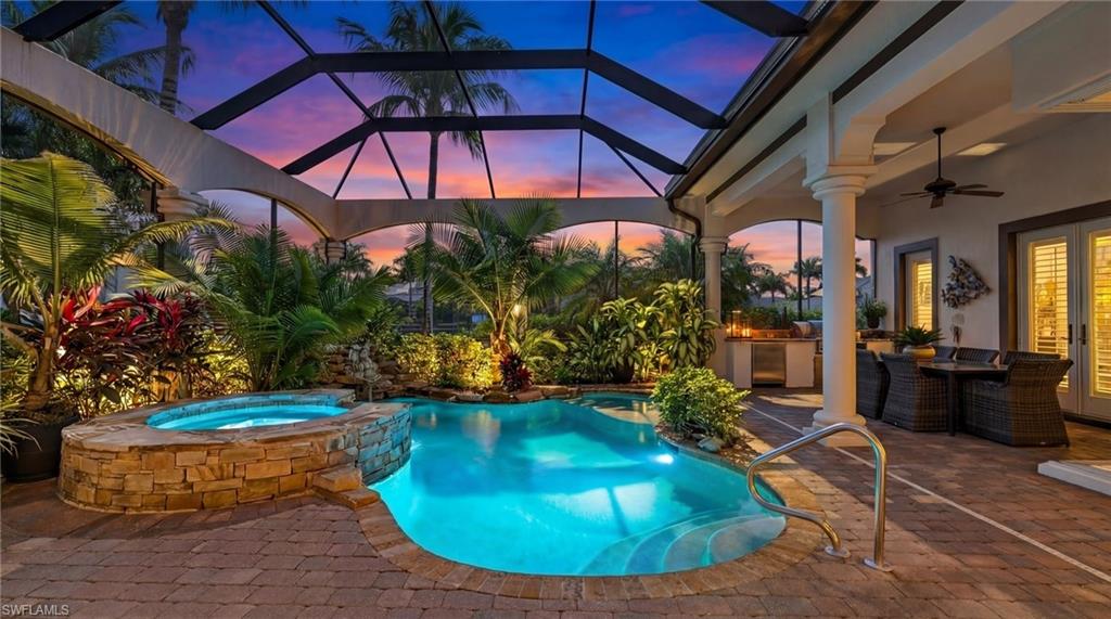 Welcome to an exceptional waterfront retreat offering almost 3,200 sq. ft. inside Miromar Lakes Beach & Golf Club—where luxury living comes with a lakefront soundtrack and sunsets on repeat. Adding to the magic, this home enjoys desirable southern exposure, bathing the interiors and outdoor living spaces in beautiful natural sunlight throughout the day. **Even better, this residence is refreshingly low-maintenance: landscaping and pool service are included, so you can spend more time enjoying the lifestyle and less time managing it.Recently refreshed with new flooring and a more open layout, this home blends polished elegance with effortless comfort. Inside, you’ll find three en-suite bedrooms, a versatile den, and a convenient half bath. The owner’s suite is a true sanctuary, featuring a generous flex space that easily becomes a cozy sitting area, private office, or your “do-not-disturb” zone. The kitchen is designed to be the heart of the home with abundant prep space, and both a casual dining nook and breakfast bar for easy mornings or relaxed entertaining. Just off the kitchen, a wet bar keeps hosting seamless—whether you’re mixing cocktails inside or serving guests out on the lanai. A dining room sets the stage for elegant dinners and celebrations, while the great room invites you to unwind with captivating views of the outdoor living space.Step outside to your private oasis: a spectacular lanai with pool and spa, accented by a soothing rock waterfall, plus an outdoor kitchen and dining area for effortless alfresco gatherings. Boating lovers will appreciate the semi-private dock, ideal for sunset lounging and easy access to over 700 acres of freshwater lakes—perfect for cruising, skiing, fishing, paddling, or simply living your best “lake day” life.**Practical upgrades round it out: a spacious 3-car garage with insulated doors and a new epoxy floor, new exterior paint, a 2023 roof, and a whole-house natural gas generator for added peace of mind.**And the lifestyle? Signature Miromar Lakes. Enjoy world-class amenities including a full-service spa and fitness center, tennis, pickleball, bocce, a 9-hole putting green, half-court basketball, miles of sandy beaches, multiple indoor/outdoor dining and bar options, a theater, and more. The Miromar Lakes Golf Club offers private membership for championship golf.Conveniently located near shopping, dining, entertainment, Florida Gulf Coast University, and Southwest Florida International Airport. Meticulously maintained and beautifully updated, this home delivers the ultimate SWFL resort-style experience—every day feels like vacation… without the checkout time.