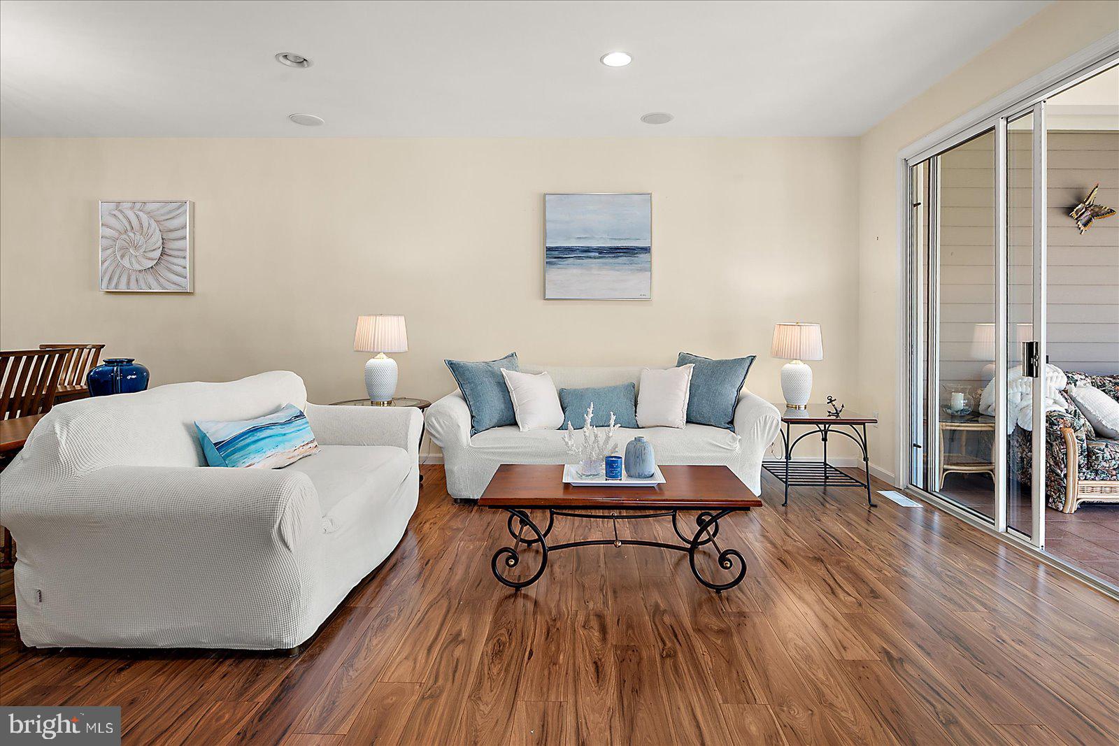 Price Improvement — Now $665,000. 38277 Ocean Vista Dr #1180 is a beautifully maintained end-unit townhome in the sought-after waterfront community of Bayville Shores in Selbyville, Delaware. Recently refreshed with a lighter coastal look and updated décor, this spacious Court Model offers over 2,650 sq. ft. of upgraded living space, a builder’s bump-out that enhances the open layout and natural light, extra windows, added privacy, and unobstructed pond and bay views. Ideally located just 2.5 miles from Fenwick Island and minutes to Bethany Beach, Rehoboth Beach, Lewes, and Ocean City, MD, the home features a spacious entry-level guest suite or second primary bedroom with a bright waterfront sunroom, an open main level with 9' ceilings, sun-filled kitchen with skylight, dining area, living room with gas fireplace, and enclosed sunroom overlooking the pond and Little Assawoman Bay. Upstairs, the primary suite includes a private sundeck with water views, and a third bedroom with en suite bath completes the upper level. Bayville Shores offers exceptional amenities including pools, fitness center, community center, piers, private boat ramp, kayak and boat storage, tennis, pickleball, basketball, playground, walking paths, pondfront gazebos, and more. With water included, public sewer, low Delaware Electric Cooperative rates, HOA-covered exterior maintenance, flood and hazard insurance, and short-term rentals permitted, this coastal home offers outstanding value in a prime beach-area location.