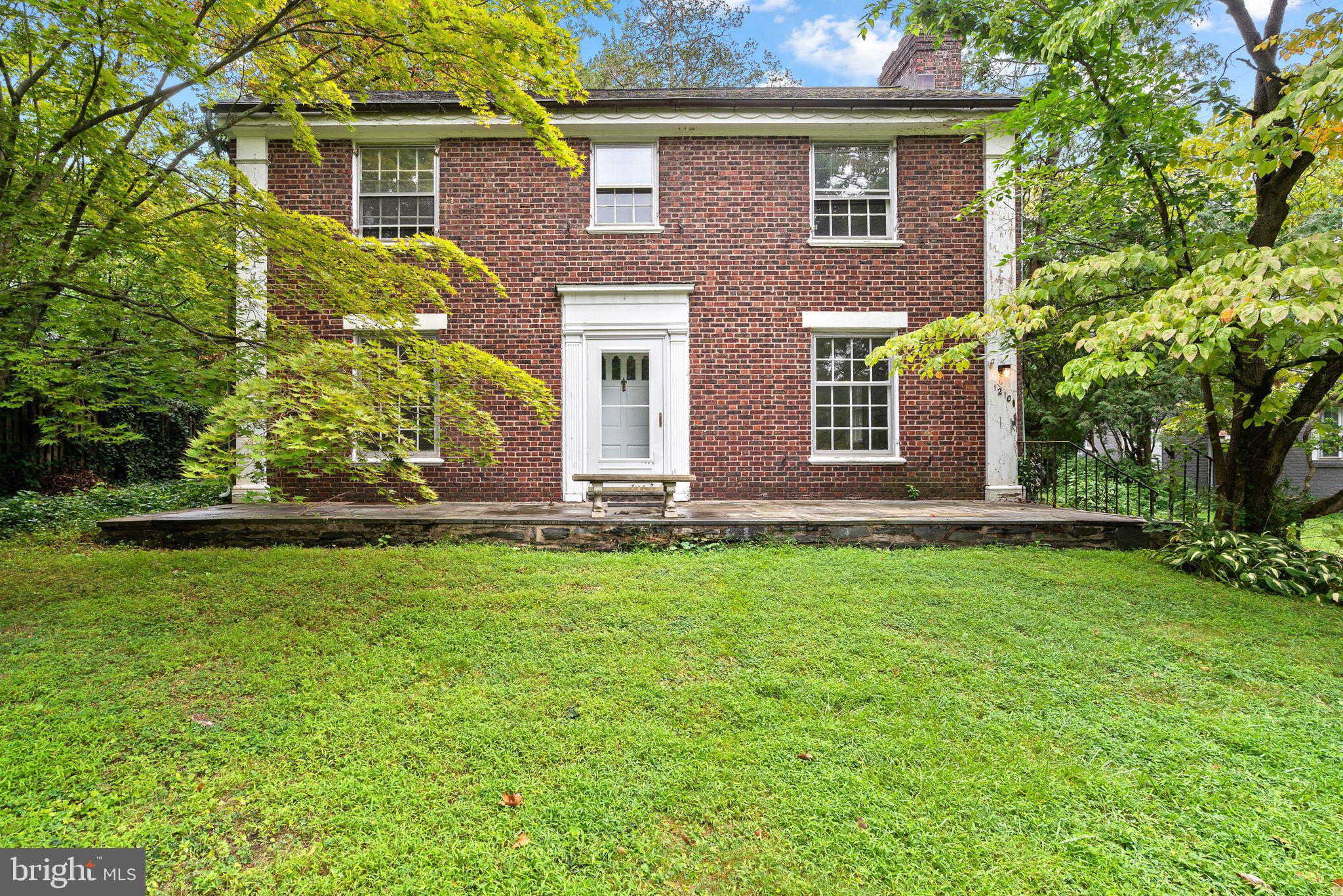 Welcome to this special gem in a highly desirable neighborhood with excellent schools, fantastic local amenities, and an easy commute to Center City! This classic 4-bedroom, 3.5-bath brick center-hall colonial sits on a private lot with lush landscaping, an attached two-car garage, and ample driveway parking. Inside, you'll find original character and charm throughout, including beautiful hardwood floors, a spacious living room with a cozy fireplace, and a formal dining room filled with natural light. The main level also features a bright kitchen and a large family room with sliders opening to the rear patio—perfect for outdoor entertaining. Upstairs hosts four generously sized bedrooms and three full baths, complimented by a full unfinished basement offering endless potential for custom finishing or storage. Brimming with potential and character, this home offers a prime opportunity to build instant equity with your custom updates. Enjoy a dream address just moments from Penn Wynne Park and convenient for everything the area has to offer. Bring your vision and make this timeless classic your own!