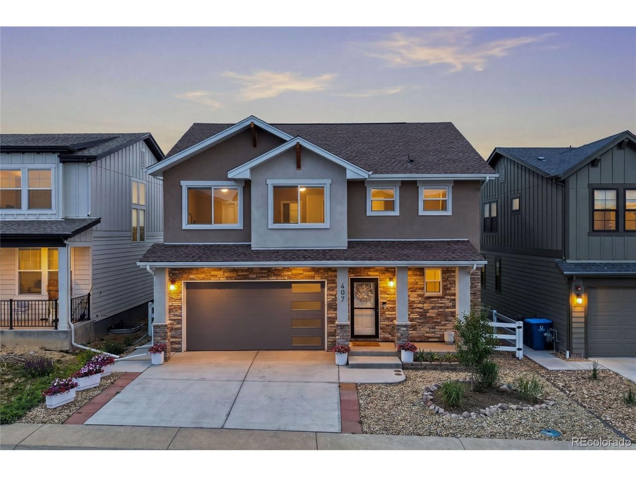 Experience the pinnacle of sophisticated, energy-efficient living in this gorgeous home, newly constructed in 2024 within Superior's highly desirable Sagamore neighborhood. Built with modern efficiency in mind to keep your monthly utility bills low, this residence features premium mechanical upgrades including a dual tankless and tank water heating system for endless hot water, a brand-new whole-house humidifier, and a smart two-zone A/C system that allows you to cool the upstairs in the summer without freezing out guests in the lower level. A beautiful front exterior and inviting covered porch lead into a massive, light-filled open great room where the living, dining, and kitchen areas flow together seamlessly as one spectacular space. The chef's kitchen is stunning, anchored by rich cabinetry and equipped with brand-new premium Samsung Bespoke appliances, including a high-end refrigerator and dishwasher. Sliding glass doors off the main living area open out to a perfect covered back patio, creating an ideal outdoor sanctuary for relaxation that overlooks quiet open space with great views and a brand-new fence. Upstairs, the primary suite serves as a true sanctuary, boasting a gorgeous five-piece en-suite bath and a specially designed, custom walk-in California Closet. Three additional upstairs bedrooms-two of which feature their own custom California Closets-share a well-appointed full bath, alongside a conveniently located second-floor laundry room. The finished basement expands your living space significantly with a massive bonus room, plus a private guest bedroom and an additional full bathroom that provides the perfect extra space for visitors. This quiet, community-oriented neighborhood offers an unbeatable, walk-to-everything location with Target and Whole Foods just beyond your front door, making grocery shopping trips, dining out, and daily commutes absolutely effortless.