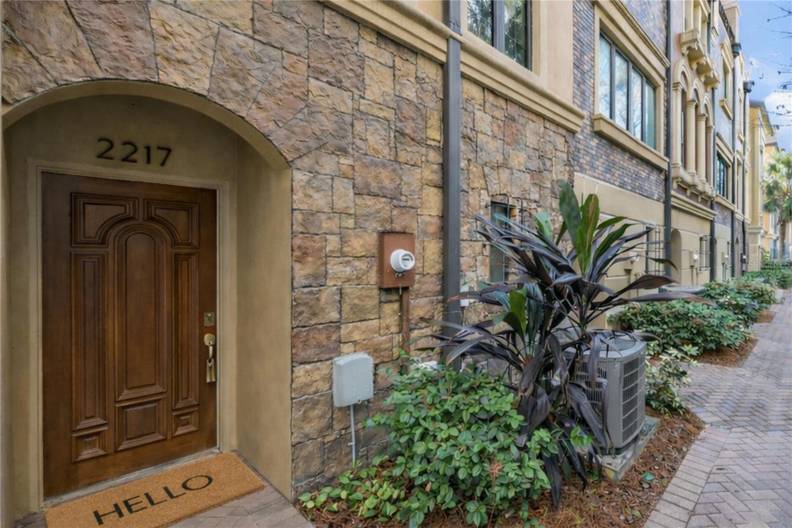 One or more photo(s) has been virtually staged. Welcome to The Brownstones of SoHo, a premier townhome community in the heart of South Tampa, offering refined urban living with exceptional walkability and everyday convenience. This impeccably maintained 3-bedroom, 2.5-bath, multi-level residence spans over 1,600 square feet and delivers an ideal balance of lifestyle, space, and value.The main living level is thoughtfully designed for both relaxed living and entertaining, featuring rich engineered hardwood flooring, soaring ceilings, and abundant natural light that enhances the open, flexible living and dining layout with room for a dining table. The chef-inspired kitchen is beautifully appointed with granite countertops, stainless steel appliances, custom cabinetry, and a casual kitchen seating area alongside bar seating—ideal for everyday living as well as effortless hosting.The top-level primary suite is a true private retreat, intentionally positioned to provide separation from the main living areas. This serene space offers a spa-style bathroom, custom closets, in-suite laundry, and a spacious private terrace—perfect for quiet mornings, evening unwinding, and a sense of personal escape.Two additional guest bedrooms and a full bath provide excellent flexibility for visitors, a home office, or evolving lifestyle needs.Additional highlights include a 2-car tandem garage with storage, fresh interior updates, low-maintenance living, location within Flood Zone X (not in a flood zone) for added peace of mind, residence within an A-rated school district, and the benefit of a new roof installed in 2024.The location is truly unmatched—just minutes from South Tampa’s most celebrated restaurants, bars, and nightlife, with the added luxury of walking to Bayshore Boulevard for scenic runs, waterfront strolls, and unforgettable sunsets, or to Historic Hyde Park for elegant shopping and dining. Ideally situated approximately seven minutes from the University of Tampa, and conveniently close to downtown, major business districts, and Tampa International Airport, this home is well-suited for homeowners, professionals, or investors alike.A rare opportunity to own a turnkey townhome in one of Tampa’s most desirable neighborhoods.Inclusions: Dishwasher, Disposal, Dryer, Electric Water Heater, Microwave, Range, Refrigerator, Washer, Primary bedroom wall-mounted TV.