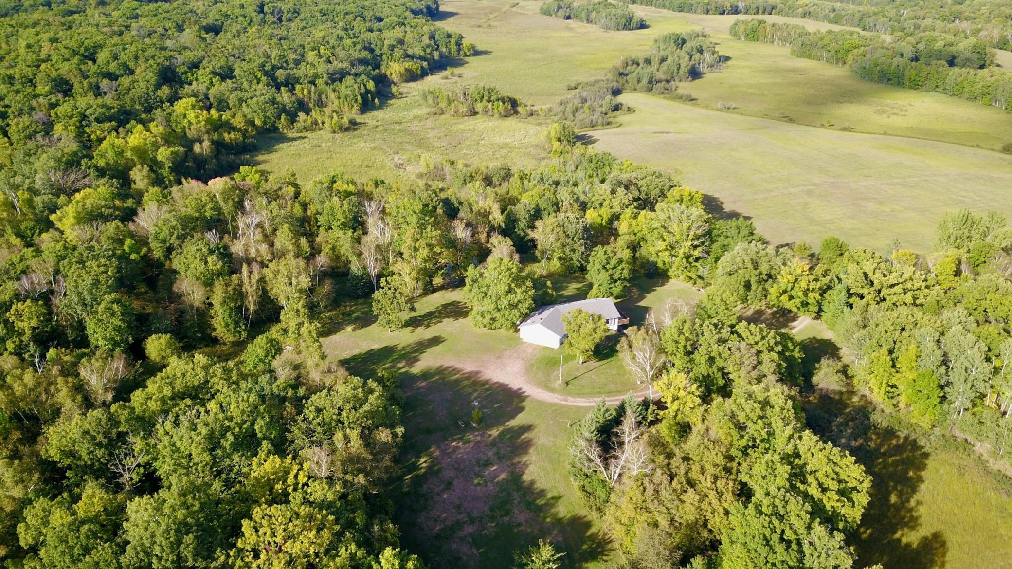 Located between Long Prairie & Little Falls and Built in 2000, here is a 3 bed 3 bath Walk-Out Rambler on 60 heavily wooded acres with two ponds! If privacy is what you are looking for, this property fits the bill located at the end of dead end road and access via easement it doesn't get much more private than this! It's majestic! Property features: Oversized two stall garage 32x26, Steel Siding, Roof in 2021, Deck, Wildlife Galore and so much more!