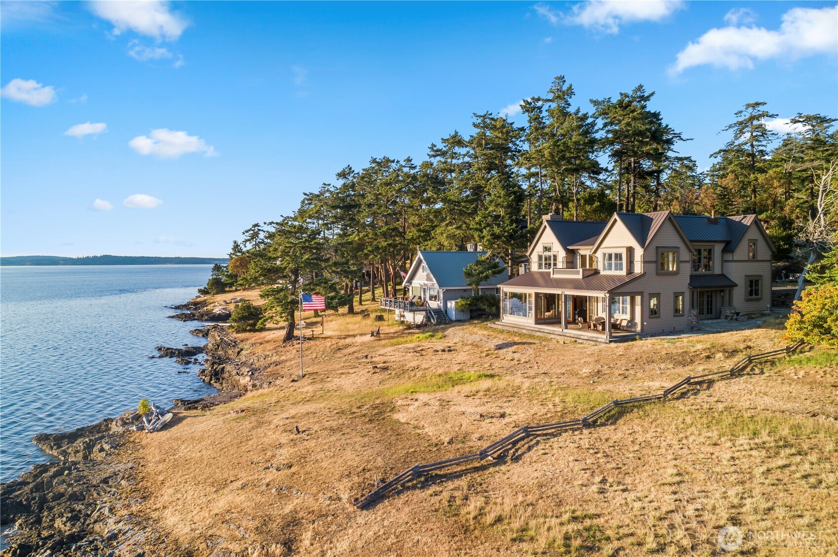 Experience the ultimate in coastal living in this stunning Craftsman-style home set on no-bank waterfront in the coveted community of Cape San Juan. Beautifully crafted with timeless high-end finishes. Impeccably maintained. Enjoy western exposure for unforgettable sunsets. The chef’s kitchen & living areas open to a heated covered patio perfect for year-round dining & entertaining. Primary suites on both levels provide luxury & flexibility. Two additional bedrooms are thoughtfully positioned for privacy. Unwind by the cozy fireplace or launch your kayak or paddleboard from the pebble beach. Enjoy abundant wildlife, your own mooring buoy & community amenities including a pool, marina & sandy beach. A rare retreat for making lasting memories