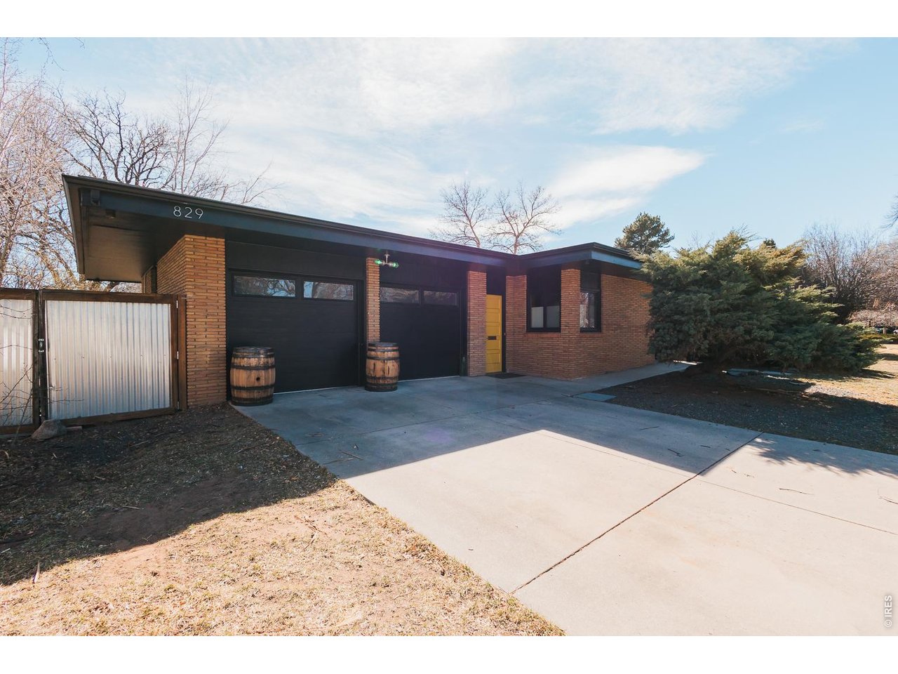 829 Juniper boasts one of the most iconic mid-century exteriors in the Arthur Sheely neighborhood.Built circa 1955, this all-brick beauty features three bedrooms and two updated bathrooms. Features include: hardwood flooring, glass block throughout, an updated kitchen and appliances, updated bathrooms, new Pella windows and sliding doors, a new furnace and air conditioner, a whole home humidifier, new garage doors, a new sealed garage floor, a new hot tub, an open floor plan, and a wood-burning fireplace. Outside, enjoy two separate concrete patios and a new hot tub, all within a private and spacious backyard, and situated on a quiet street in one of the most desirable neighborhoods in Fort Collins. 829 Juniper is ideally located just steps to the Spring Creek Trail, CSU, the Mason Trail Mid-town, and Downtown.