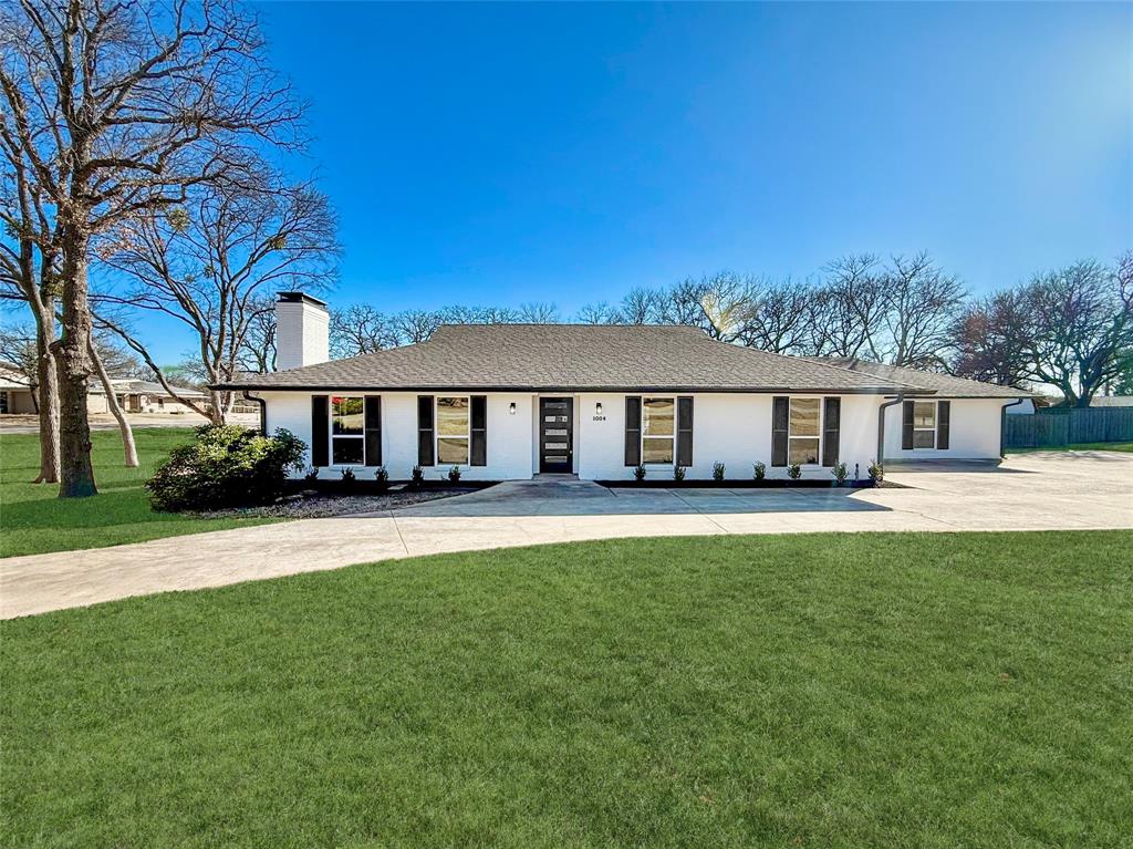 *OPEN HOUSE this SUNDAY, February 15th from 1PM - 3PM* Welcome to 1004 Timber Creek Dr, a completely remodeled and impeccably styled home in the quiet, highly desirable community of Timbercreek Acres in Lewisville, TX, conveniently located near Founders Classical Academy. Homes in this peaceful neighborhood rarely come available, making this a truly special opportunity to own a sought-after slice of Lewisville on just over half an acre shaded by mature trees. This pristine 3-bedroom, 2-bath residence has been thoughtfully updated from top to bottom, featuring beautiful engineered hardwood flooring throughout, stunning quartz countertops, and an abundance of natural light through all-new windows. Every detail has been refreshed with care, including brand-new plumbing and electrical systems, offering modern comfort and peace of mind. Step outside to your private backyard retreat — complete with a replastered pool, an expansive pool deck with a built-in firepit, and plenty of space to relax or entertain under the trees. Two oversized multi-use sheds provide endless flexibility for storage, a workshop, studio space, or backyard hobbies. Even the garage shines with a new epoxy-coated floor, adding a sleek finishing touch to this move-in-ready property. This is a rare chance to own a beautifully upgraded home in one of Lewisville’s most tranquil and established neighborhoods — ready for you to add your own personal touch and make it truly yours. Don’t miss it — this one won’t last long.