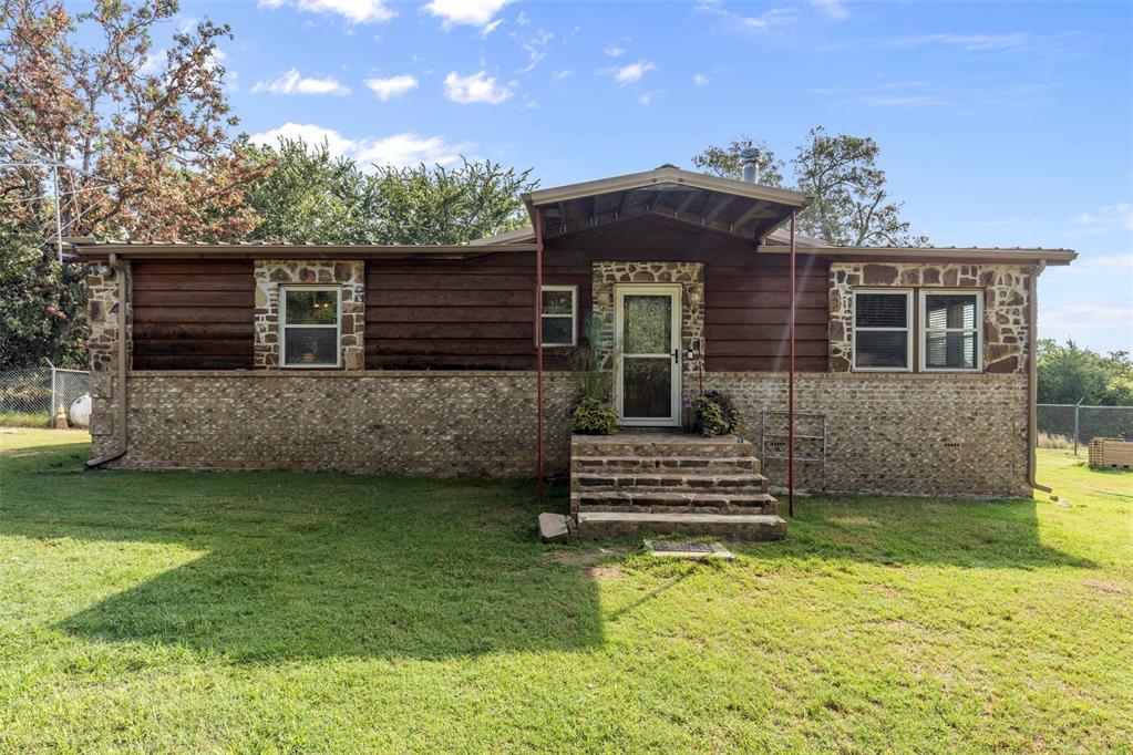 Welcome to your own private retreat just outside the city! This 2-bedroom, 2-bath, 1,344 sq. ft. home sits on a concrete footing and has been beautifully finished with rock and brick for lasting charm.

Nestled on 10 wooded acres, this unrestricted property is perfect for those who want room to roam! Bring your livestock, enjoy the abundant wildlife—including deer and turkey—or simply take in the peace and quiet of nature.

The home offers a cozy, functional layout including a wood-burning stove and a back deck ideal for grilling, morning coffee, or watching wildlife in your own backyard. Also included is the convenient covered lean-to storage shed. The property has it's own water well and propane tank. There is a power pole located on the property for those looking for RV hookup capability and the city of Norman handles the trash.

Located off of a blacktop road, the property is:

2 mins to Lakeview Elementary

5 mins to the Lake Thunderbird Boat Ramp

15 minutes to the City of Norman

10–15 minutes to I-40 for an easy commute

This is the best of both worlds—rural living with city convenience. Whether you’re looking for a homestead, recreational getaway, or simply a peaceful place to call home, this property checks all the boxes.