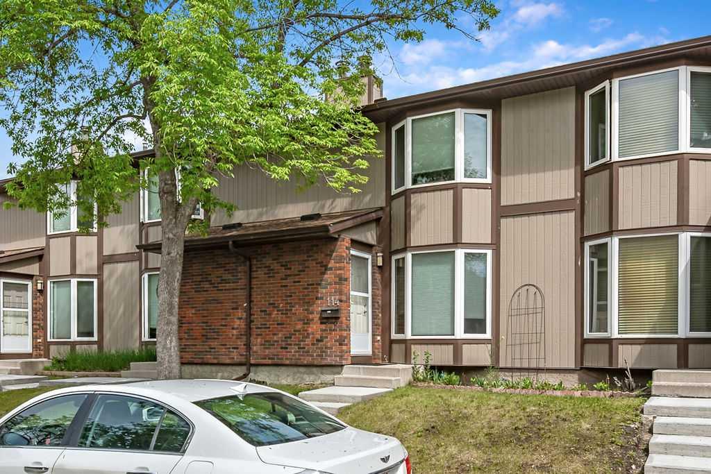 Welcome home! In 2021 this great three bedroom unit received a bright, new kitchen with an eating bar, backsplash, new vanity, and updated main bathroom. The main floor features hardwood and tile flooring. The woodburning fireplace in the living room makes a beautiful feature wall and you'll appreciate the convenient main floor powder room, perfect for guests. Upstairs you will find a bright and spacious primary bedroom featuring a generous closet with custom built closet organizer, as well as two more bedrooms and a 4 piece bath. The basement family room has been partially developed and is ready for your personal touches. Outside, you will appreciate your own private, fenced yard with patio, leading to your parking stall. This townhouse complex is pet friendly with board approval.