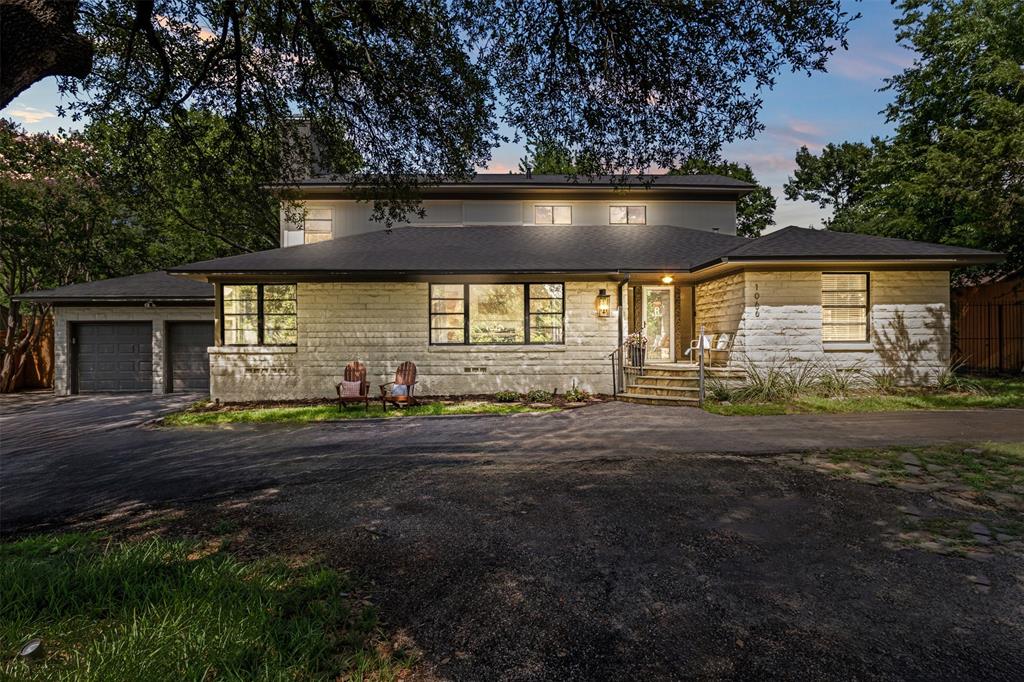 Welcome home to 1066 N. Buckner Boulevard. This wonderfully updated home features a flexible floorplan with 4 Bedrooms, 3.5 Baths, 2 Living Areas and an Office.  The home is perched on an elevated .467  lot and is nestled in the trees providing shade and privacy. Upon entering you are welcomed with warm hardwood floors and a generously sized dining area with a decorative gas log fireplace. Huge kitchen is the heart of the home, featuring an oversized island that is a perfect setting for gatherings with family and friends. Kitchen features: quartz countertops, custom cabinetry, side by side commercial grade refrigerator-freezer and gas cooktop range. Open to the kitchen is the den with vaulted ceilings, tons of windows overlooking the huge backyard and covered patio. Upstairs are 2 bedrooms including the primary with an updated ensuite bathroom.  Also, upstairs there's an additional cozy living area, and another bedroom and updated bathroom. The backyard features a massive resort style, covered patio with an electric fireplace and space for outdoor living and dining areas. Other updates include: Roof 2021, New HVAC (downstairs) 2021, Tankless hot water heater 2023, covered patio with electrical fireplace 2023, gutters 2022, fence 2022, front iron fence 2022, and asphalt circle drive. Walk to White Rock Lake and enjoy the extensive trails to hike and bike and some of East Dallas' newest and best restaurants, bars, and shopping.  Exemplary Hexter Elementary School.