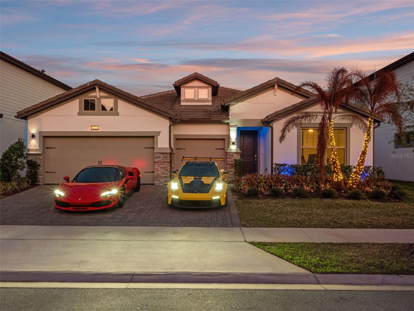 Welcome to a one-of-a-kind masterpiece in the coveted gated community of Phillips Grove—a fully customized, renovated residence unlike anything else in the neighborhood. Every inch of this home has been thoughtfully reimagined with luxury finishes, architectural enhancements, and curated details you simply must see in person. Step inside to discover imported stone countertops, a chef-inspired kitchen with a 5-burner gas cooktop, built-in oven and microwave, and a HUGE walk-in pantry with exceptional storage. The main living spaces showcase stunning Belize Azul flooring, elevated custom ceilings with LED lighting, and a show-stopping stone fireplace wall that anchors the family room with modern elegance. A custom-built bar—complete with wine/beverage cooler and floating shelving—creates the perfect setting for entertaining.The oversized primary suite offers private access to the backyard oasis, while the en-suite bath delivers true spa luxury with a custom soaking tub, walk-in shower, and a boutique-style closet with built-in cabinetry. A thoughtful 3-way split floor plan ensures privacy for all, and the 4th bedroom features its own en-suite bath with walk-in shower.Step outside to the pièce de résistance—a COMMERCIAL-GRADE outdoor kitchen and 6 seater bar designed for the ultimate host. Outfitted for multiple TVs, built-in grills, smokers, hibachi grill, beverage coolers, and more! This space transforms everyday living into resort-style enjoyment. An outdoor full bath adds convenience for guests, while the turfed yard, lush landscaping, and privacy create a serene retreat for dining, lounging, and entertaining.Additional highlights include:Oversized 3-car garage with an extra 4 feet of length for enhanced storage.Quiet cul-de-sac location.Community amenities:Half court basket ball, tennis courts, swimming pool, playground and golf-cart friendly streets. Minutes to Restaurant Row, Whole Foods and Trader Joes. 10 minutes to Disney World, 1 mile to Lakefront Dr. Phillips Park, and minutes to I-Drive, world-class dining, shopping, and downtown OrlandoThis home is truly a rare find—a custom luxury experience within one of Central Florida’s most sought-after communities. You must SEE it in person to appreciate the craftsmanship and detail. Call today for your private tour.