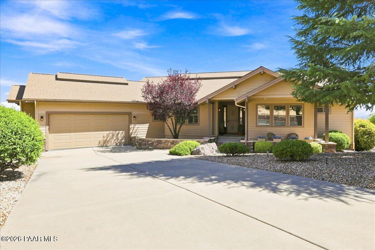 Beautifully remodeled multi generational home, better than new! This stunning home sits on a large north-facing corner homesite and features an expansive, multi-purpose fenced courtyard perfect for creating a peaceful Zen garden or enjoying Prescott's year around gorgeous weather. Located within the prestigious Summit at Prescott Lakes Community, the home captures breathtaking sunsets and panoramic views of the San Francisco Peaks, Granite Mountain, and the Granite Dells. The main level offers a spacious primary suite with a large walk-in closet and deck access, plus a generous 2nd bedroom/in-law suite with an ensuite bath and walk-in closet. An office/den/potential bedroom is conveniently located just off the living room, which features vaulted ceilings and a beautiful stone gas fireplace. A separate dining area complements the gourmet kitchen, complete with ample cabinetry and storage, granite counters, 2 sinks, and a large walk-in pantry. Off the garage the large laundry room and half bath add convenience. The lower level features a huge open family/media/hobby room with a 2nd gas fireplace, a 3rd large bedroom, full bath, and utility room for additional storage. From the fenced backyard the multiple outdoor entertaining spaces invite you to enjoy the Northern Arizona lifestyle. Relax on the expansive viewing deck, sit beneath the covered patio, or unwind and play in the fenced side courtyard. The oversized, extra deep and wide 2 car garage features recently added epoxy flooring, along with new garage door wood framing and paint. This move in ready property reflects extensive improvements made by the current owners, including new window seals, new shutters throughout the whole home, new LifeProof and waterproof LVP (luxury vinyl plank) flooring, interior paint, new kitchen appliances, new washer & dryer and all updated bathrooms featuring new granite counters, faucets & sinks, toilets, showers, and light fixtures. Additional improvements include new electrical & added dimmers in outlets, whole house extensive vent cleaning, significant landscaping improvements and additions, and added front & backyard drainage for the new owner's peace of mind. The roof was replaced approximately 9 years ago, and the HVAC system was recently tuned and works great. Prescott Lakes is an amazing, sought after community centrally located in Prescott, offering year-round private clubhouse amenities with your membership (golf membership optional). Amenities include private golf on the 18-hole Hale Irwin-designed golf course, a world class fitness center, indoor pool & outdoor pool, spa, 5 pickleball and 2 tennis courts, full service restaurant/bar, numerous fitness classes, and many social events & clubs. Bring your active and social lifestyle to this beautifully updated home and enjoy the mountain views, amenities, and exceptional Prescott Lakes living!