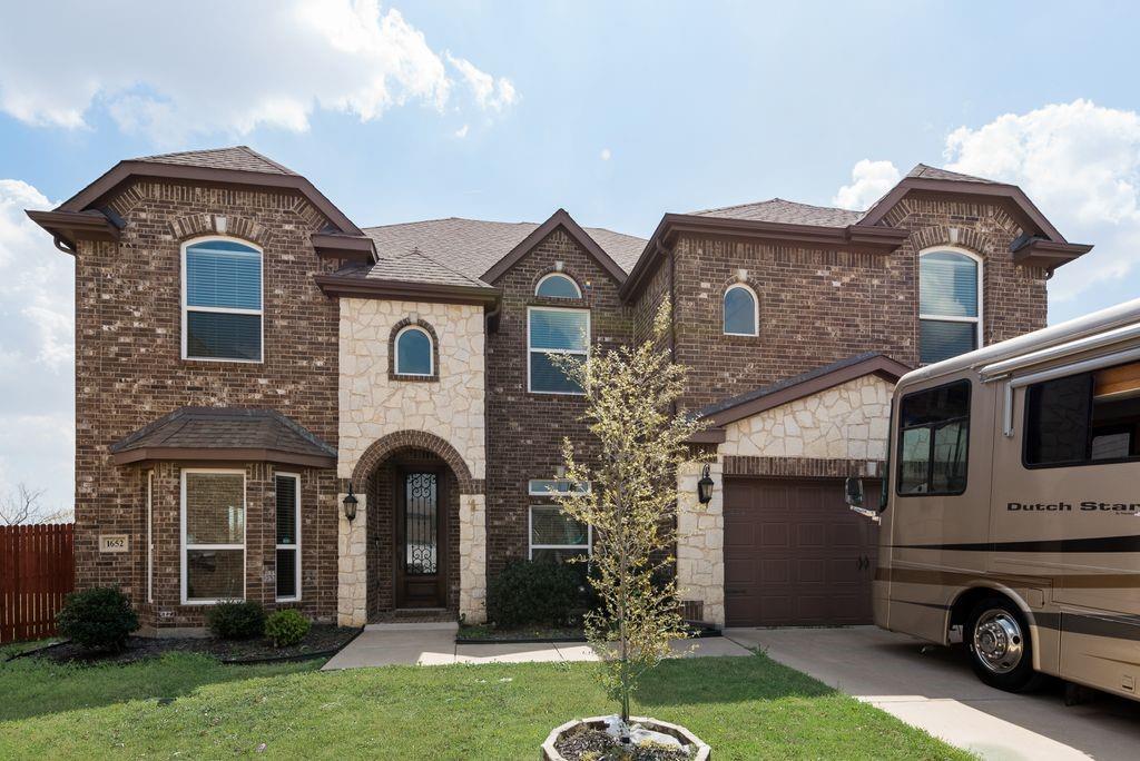 Amazing sun-light-bathed home with five bedrooms all with walk-in closets, a family room, game room, and a media room with wet bar! Home boasts upgrades others can’t: every room wired for fiber optic internet which offers faster speed and higher bandwidth, wide handicapped entrance, iron entrance door, tankless water heater, central vacuum machine, utility room plumbed with both hot and cold water for utility sink, granite countertops everywhere, reinforced fence. Spacious, open floor plan seamlessly connects living, dining, family room, and kitchen areas - perfect for entertaining and family gatherings. Modern appliances, double ovens, and gas cooktop makes the kitchen a chef’s dream. Covered patio is perfect for family and friends’ gatherings. Large master bedroom, complete with ensuite bathroom, a relaxing tub, dual sinks, and separate shower. This home is situated in the highly sought-after Northwest ISD with proximity to shopping centers, restaurants, parks. It is near the 287 and 35 fwys giving easy access to the entire metroplex.  A must-see!