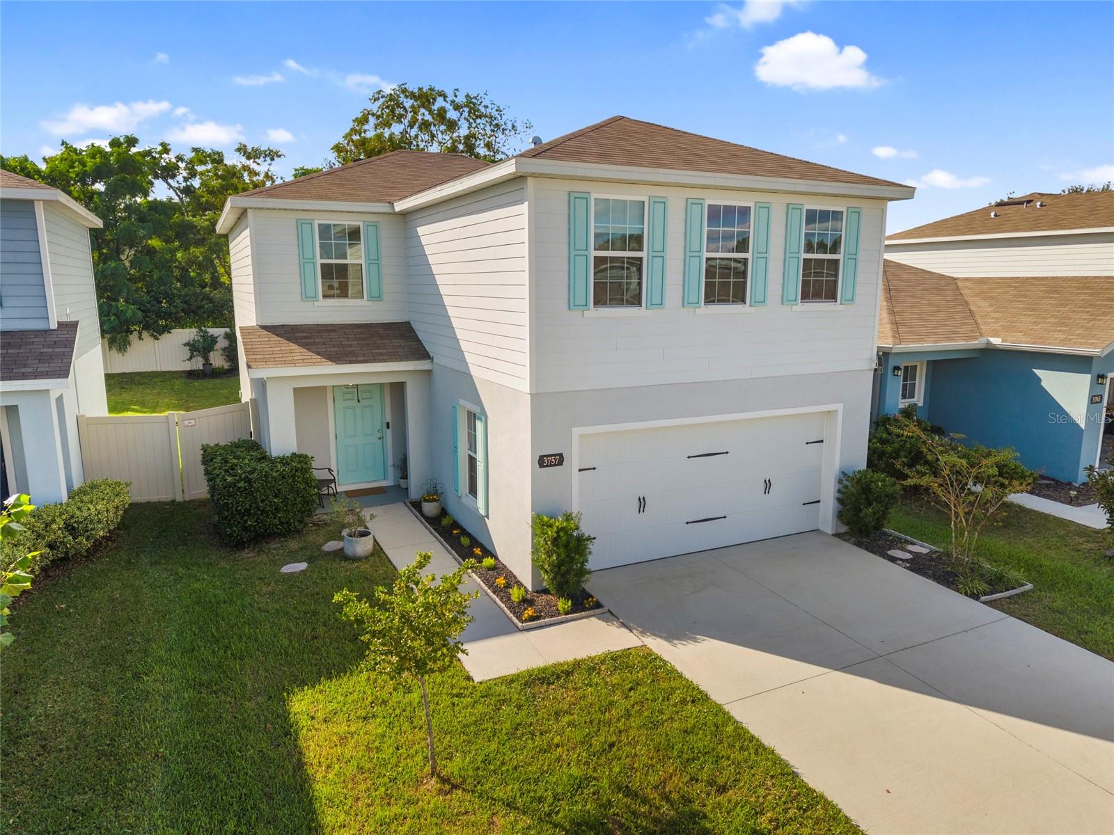 Built in 2022 and finished with details most new construction never gets, 3757 Zephyr Preserve Place is a 4 bedroom, 2.5 bath home with a 2 car garage in Zephyr Place, a community with no CDD and a low quarterly HOA ($103/month).  SPECTRUM CABLE AND INTERNET INCLUDED (plus HULU, Disney+, Paramount+, HBO MAX and more).  Also includes Nest Smart Thermostat. The foyer sets the tone with a hand finished whitewashed brick accent wall, a floating wood shelf, and a barn style sconce. From there the first floor opens into one connected living space. The kitchen centers on a large island with seating, a pair of matte black cone pendants, and a pull down gooseneck faucet, framed by white shaker cabinetry with black hardware, stainless steel appliances, and a pantry. The dining area sits under a black candle style chandelier beside sliding glass doors to the backyard, and the living room pairs wood look flooring with natural light from windows on two walls. A half bath completes the main level. Upstairs, the primary suite stretches nearly 20 feet with a large walk in closet + smaller closet the owner has turned into a work station. Private bath featuring dual sinks and a walk in shower. Three secondary bedrooms share a full bath with a tub and shower combination, and the laundry room is on the same floor, right where the laundry happens. The living room and every bedroom have matte black LED ceiling fans. The backyard is fenced in vinyl on every side but 1 and is SET UP FOR ENTERTAINMENT. A paver patio holds a hardtop gazebo with pendant lighting, string lights stretch across the yard, and a custom built in bench of wood and corrugated metal with integrated planters adds permanent seating + storage and greenery. A mulched play area and landscaped borders round it out. Newer construction, real upgrades, and an outdoor space that is ready to use the day you move in - while avoiding the high HOA/CDD fees of other homes.