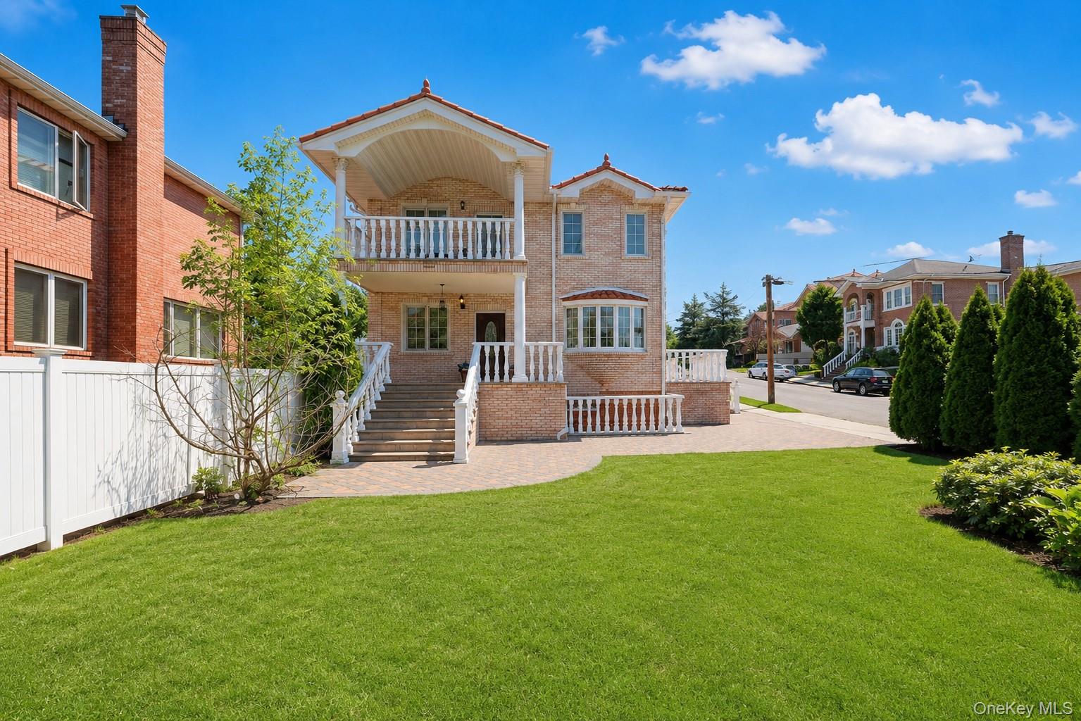 A rare opportunity to own a CORNER sophisticated home that delivers exceptional suburban living with easy urban access.Ideally located just steps from Jmart, Food Bazaar, and the vibrant dining scene along Northern Blvd. Conveniently close to schools, parks, shopping, and transportation (I-495,LIRR, Q12 and Q36).Built with high-end brick construction, ductless AC units, a detached carport, and generous private front yard. The thoughtfully designed layout 4-bedroom, 3.5-bathroom luxury residence features a convenient first-floor bedroom with a full bath — ideal for guests or extended family. The second floor boasts a spacious primary suite with a private terrace and an en-suite bath, along with two additional bedrooms, another full bathroom,and an expansive 2nd FL terrace with beautiful outdoor views. Downstairs HIGH CEILING basement features entrance and exit for safety.Too many features to mention — a must-see home in a highly desirable neighborhood!