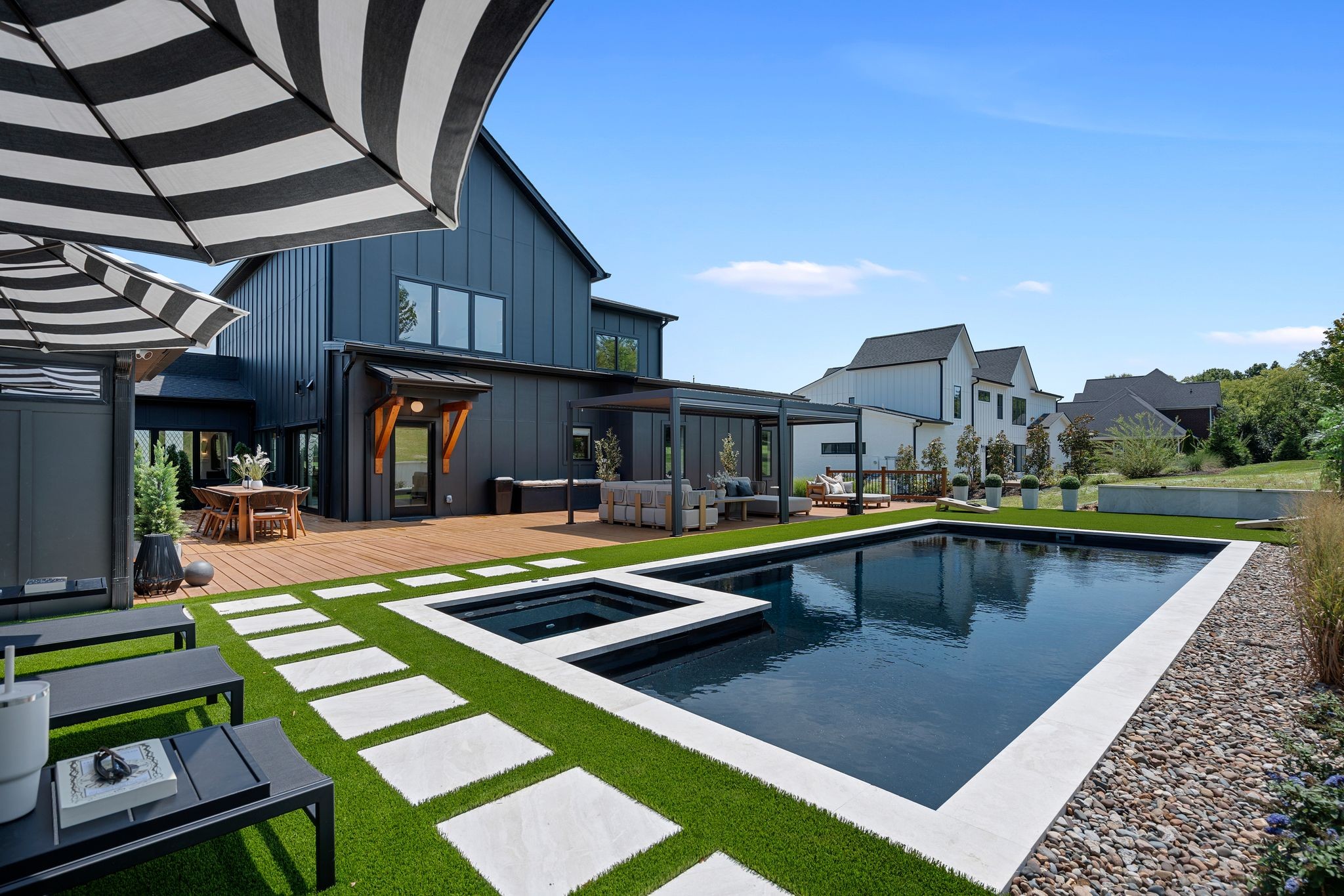 Some people buy new construction and move in. These owners bought new construction and made it better. Built in 2025, this modern organic home sits on nearly .8 acres with no HOA and has been thoughtfully upgraded to create a home that is custom, polished and exceptionally livable.Inside, soaring ceilings, hardwood floors, dramatic lighting and abundant natural light set the tone. The renovated kitchen combines great design with serious function, complemented by a hidden walk-in butlers pantry that keeps everything beautifully organized and out of sight. The spacious primary suite has been elevated with a his and hers custom closet and private sauna because obviously your own spa is better than a spa membership. The same philosophy carries throughout the home. A fully built-out home gym means your workout is steps away, while the backyard has been transformed into a private oasis centered around the newly added heated, saltwater pool that is still under a transferrable warranty to the new owners. There’s plenty of room to lounge, entertain, unwind and spend an entire weekend without ever feeling the need to leave. Even the addition of a convenient pool-area bathroom was designed to make outdoor living easier. With 4 bedrooms, a fireplace, generous living and entertaining spaces and a layout that balances openness with places to retreat, this home offers something increasingly hard to find: a wellness focused lifestyle where the gym, spa, pool, and your favorite place to relax are all at the same address. It was beautiful when it was built. The current owners just finished the job.