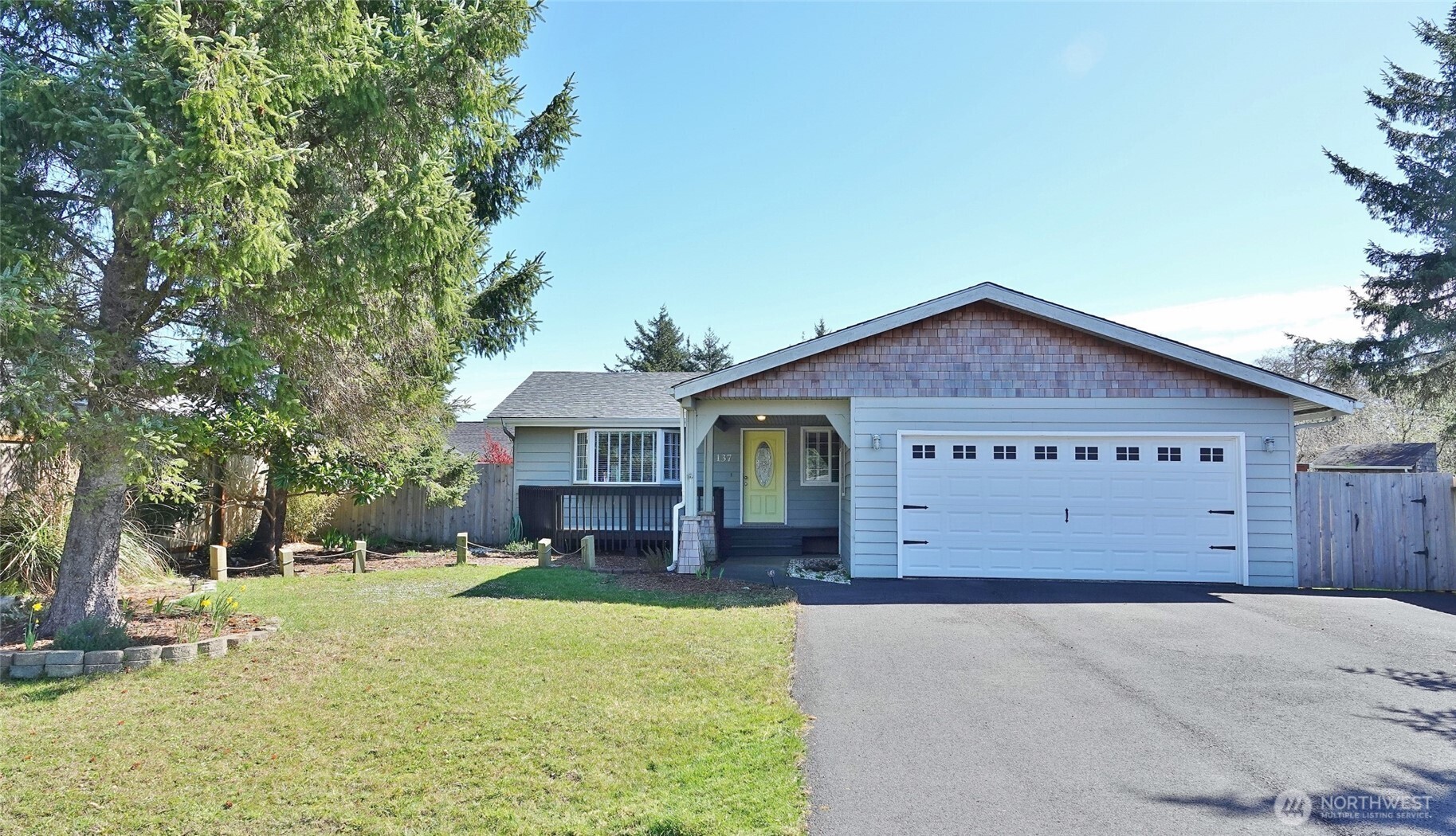 INCREDIBLE PRICE for this Nicely RENOVATED HOME in LOVELY NEIGHBORHOOD with a NEW ROOF! Driving up to this 3 BD, 2 BA, 1144 sq.ft. home, you will notice its street appeal ~ full asphalt driveway, landscaping with lawn and trees, covered area leading to the Garage, Front Deck and Entry. Remodeled inside in 2019-2020. LVP flooring through-out (tile in the bathrooms). Open Great Room design with a bay window and propane fireplace insert in the Living Room. Kitchen with a large Island, newer cabinets and appliances, painted butcher block counters, and classic white tile backsplash with some floating shelves. Dining Area with a slider to the Rear Deck and the spacious Fully-Fenced and Landscaped Backyard with lawn and a large 10'x12' Tuff Shed with loft. Remodeled Bathrooms with mosaic white tile floors, vanities, and more. New Garage Door in June 2025, and Garage Door Opener in Jan 2026. New Roof in Jan 2026 is a 40-yr comp shingle roof with some new plywood underlayment installed. Tankless propane hot water heater.