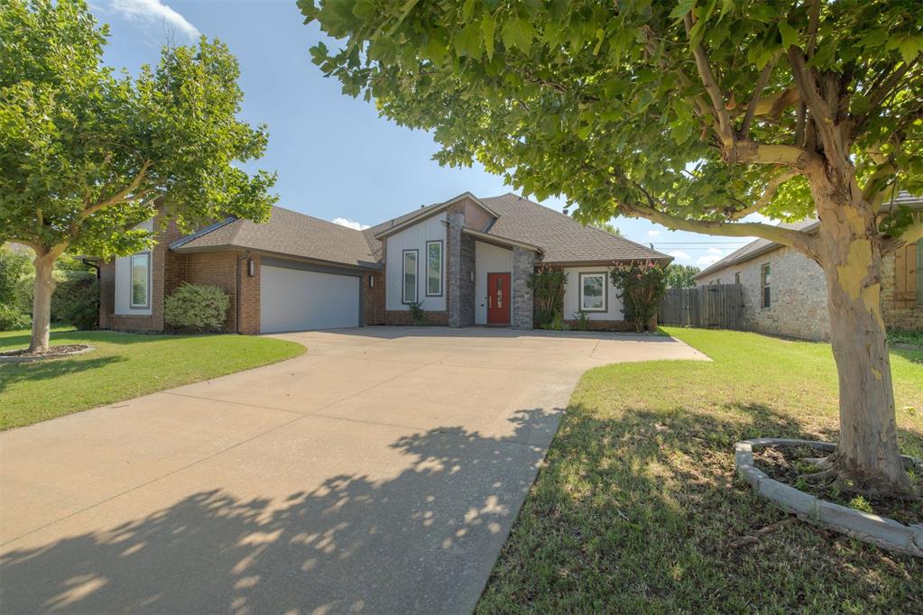 Located in an Edmond school neighborhood with OKC utilities, this spacious and well-designed home offers a flexible layout, modern updates, and convenient access to the Kilpatrick Turnpike, shopping, and dining. Built by Jeff Click, known for his clean, contemporary design and thoughtful layouts, the home features a split floor plan that offers added privacy between the primary suite and secondary bedrooms. The primary suite includes a freestanding soaking tub, oversized walk-in shower, dual vanities, and a large walk-in closet that conveniently connects to the laundry room.

The kitchen features matching stainless-steel appliances, including a refrigerator and wine fridge, and a large island with extended bar seating. It flows into a warm and inviting living area highlighted by modern concrete and wood flooring, exposed brick accents, and a cozy indoor fireplace. Off the main living area are two flexible spaces—one at the front of the home that can serve as a dining area or office, and a second currently set up as a fully equipped media room with projector, speakers, media box, and leather lounge seating, all of which will remain with the home.

Additional highlights include an in-ground storm shelter, sprinkler system, oversized two-car garage, fully fenced backyard with brick privacy wall and outdoor fireplace, a roof replaced in 2022, and neighborhood amenities including a pool, clubhouse, and private sidewalk access to West Field Elementary.