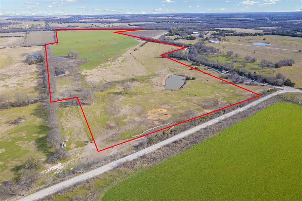 If you're looking for the perfect place to escape the city or make an investment this is the property for you! Build a house on the hill looking down into the beautiful bottom land, or run your own cattle. The entire property is fenced and cross fenced. Currently the owner is grazing cattle on wheat. The property offers great recreational potential with plenty of deer and hogs. There is also a seasonal creek at the back of the property. Owner has spent thousands clearing brush to open up the view of the bottom. Motivated seller with possible owner financing.