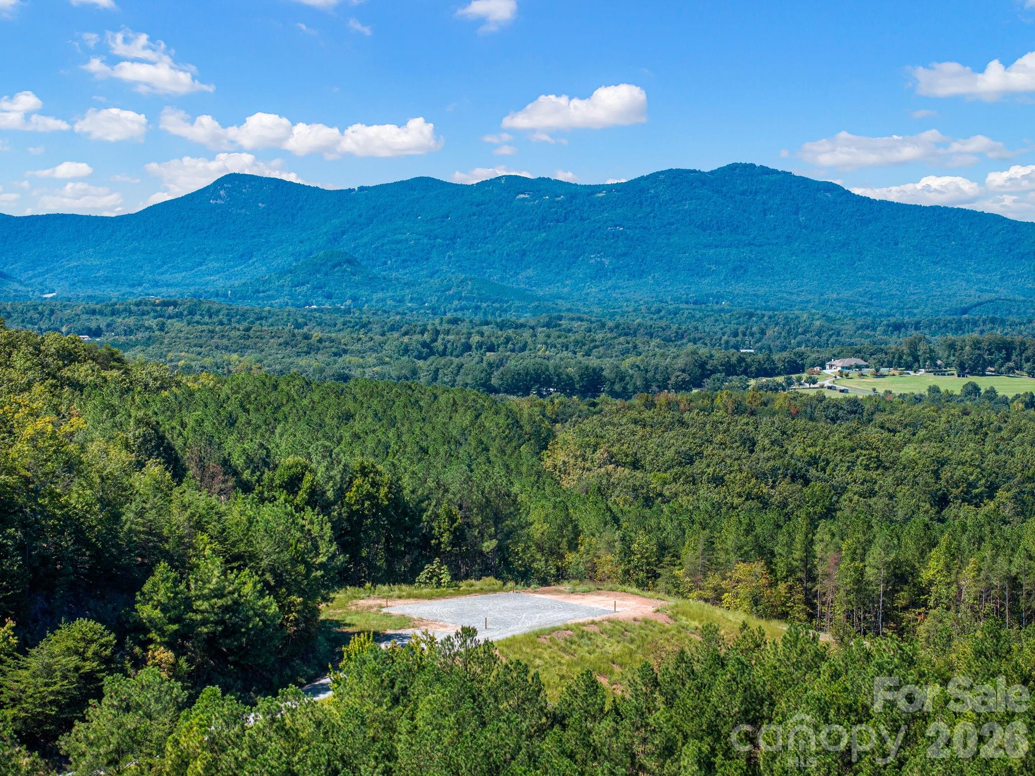 180 degrees of Blue Ridge Mountain views, 12.43 acres and the hard work already done.Set at the end of a private road, this mountaintop homesite has been extensively prepared and is ready for its next owner. Significant work has gone into opening the view, transforming what was once an approximately 60 degree view into a sweeping 180 degree long range mountain panorama. The driveway has been professionally established  and finished with #57 stone, leading to an approximately 2,500 square foot stabilized and graveled building pad with the corners already staked.A new entrance gate and fencing are in place, and septic and well evaluations have been completed. With the groundwork behind you, what’s left is the fun part. Design a full time residence, weekend mountain retreat or small horse property that takes full advantage of the views and setting. The lower portion of the acreage offers potential for small pasture, a barn or run in, giving you room to create a manageable setup for horses.For equestrians, the location gets even better. Ride straight from the property onto the FETA trail system putting miles of Hunt Country riding right outside your gate.Privately accessed through gated Hughes Creek Preserve, the property offers the feel and security of a gated setting without HOA covenants or dues.The views have been opened, the access improved and the homesite prepared. Now it’s ready for someone to take it from here and create something special in the heart of Hunt Country. Showings by appointment only.