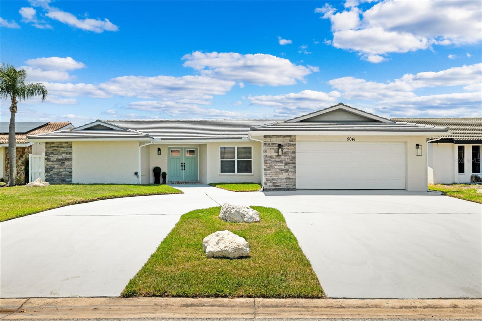 Discover the best of Florida waterfront living in Gulf Harbors in New Port Richey, where style, comfort, and quick Gulf access create an exceptional coastal retreat. This vibrant waterfront retreat delivers 67 feet of canal frontage and puts you less than a quarter mile from the open Gulf of Mexico, meaning sunset cruises, fishing trips, and waterfront dining are just minutes from your backyard. Bring the boat, the paddleboards, and your sense of adventure. Step inside and feel the energy of soaring vaulted ceilings with exposed beams, sun-filled living spaces, and stylish new luxury vinyl plank flooring throughout. The beautifully redesigned kitchen steals the spotlight with sleek stainless-steel appliances, a wine fridge ready for entertaining, a statement vent hood, and a modern drawer microwave built seamlessly into the island - perfect for hosting friends after a day on the water. Walls of sliding glass doors frame sparkling canal views, while the bay window breakfast nook is your front-row seat for morning coffee and the occasional dolphin sighting. The split floor plan keeps things comfortable and private, with a spacious primary suite that feels like a personal spa retreat, complete with dual vanities, a rain-head walk-in shower with built-in bench, and a generous walk-in closet. Guests will love having their own space too, with a private ensuite in the second bedroom and an additional full bath for added convenience. Outside is where the Florida lifestyle truly shines. A refreshed exterior, repainted tile roof and driveway, and a new paver patio create the perfect setting for sunset gatherings, weekend barbecues, or simply unwinding by the water. Located in a golf-cart-friendly community with optional access to the private beach club and neighborhood events through the civic association (a voluntary HOA), this home offers the fun, freedom, and waterfront living buyers dream about.