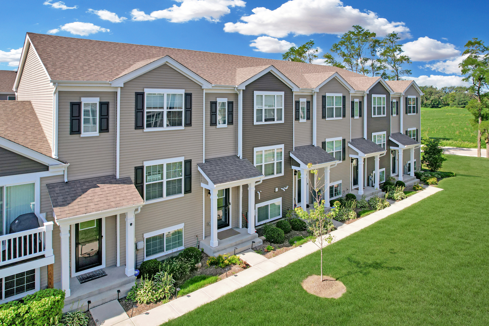 Updated Cambridge Lakes 3BR Townhome Built in 2018. Open Layout, Finished Bonus Room, Attached 2-Car Garage + Newer Mechanicals in Lifestyle Community offering Clubhouse, Pool, Gym, Parks, Fitness Center, Pond/Lake Views, fitness and yoga classes.     Step into style and ease in this turnkey 3-bedroom, 2.5-bath Lincoln townhome in the vibrant, amenity-rich Cambridge Lakes community. Built in 2018 and thoughtfully maintained, this home features a captivating open-concept layout with a balcony, upgraded wide-plank wood-look flooring, designer espresso cabinetry, abundant peninsula counter space, a walk-in pantry, and stainless steel appliances-perfect for entertaining or everyday comfort.  The primary suite offers an oversized walk-in closet and a large private bath with dual vanity sinks. Upstairs also features two additional bedrooms, a convenient second-floor laundry room, and a second full bath with a tub. The finished lower-level bonus room flexes as a home office, gym, or cozy media space. A 2-car attached garage, 2018 mechanicals, and a professionally landscaped lot enhance the ease of ownership. Enjoy views of the nearby pond and benefit from low-maintenance living.    As part of Cambridge Lakes, you'll have access to unmatched amenities: clubhouse, three pools, 12 lakes, 12 parks, fitness center, indoor gymnasium, party room, aerobics studio, and miles of scenic trails. Whether you're seeking your first home or a turnkey townhome lifestyle, this one delivers it all-location, layout, and lifestyle.
