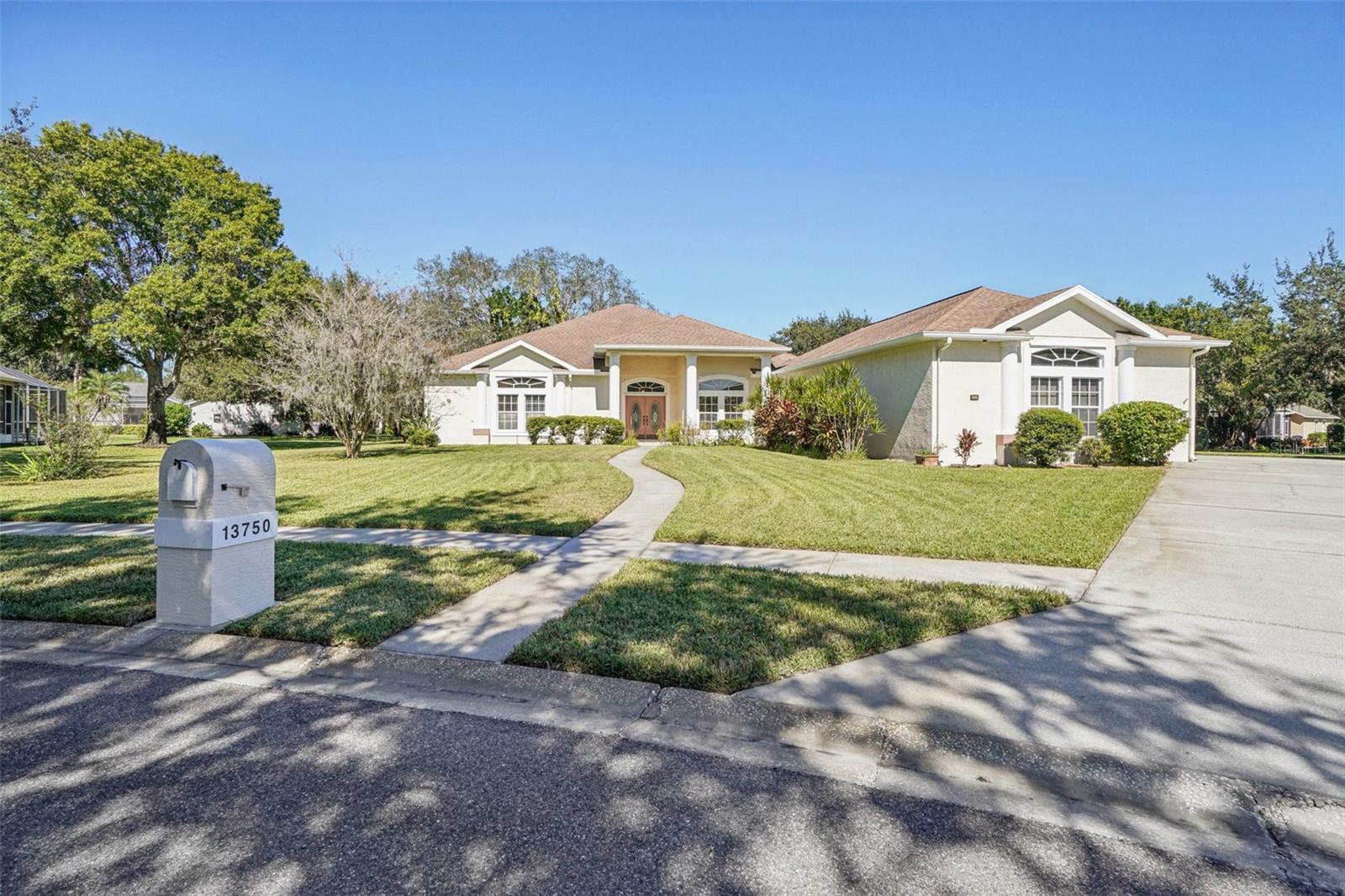 One or more photo(s) has been virtually staged. Gated community with private lake access. This home has 3 bedrooms, each with its own full bathroom and a half bath located in the family room area. The master bathroom has a soaking tub along with a large separate shower. The other two bathrooms have shower/tub combos and they each have dual sinks. Galley kitchen with a pass thru to dining and preparation kitchen to keep cooking smells contained. Large custom door openings, a screened patio, 3 car garage, and open kitchen are just a few of the amenities this home has. The screened patio is stubbed out for a sauna and jacuzzi.