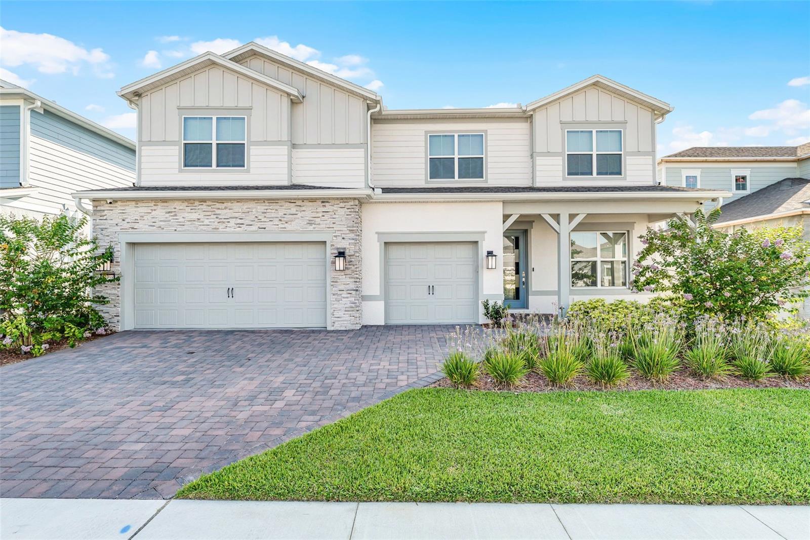 One or more photo(s) has been virtually staged. ***Where Luxury Meets Lake Nona Living*** Live the NONA lifestyle at 13758 TYBEE BEACH LANE, a breathtaking 6-BEDROOM, 5.5-BATH LUXURY HOME tucked inside the GATED COMMUNITY OF ISLES OF LAKE NONA. With STRIKING WATER VIEWS, over 5,000 SQ FT of curated living space, and SOPHISTICATED DESIGN at every turn, this residence blends ELEGANCE, COMFORT, and PRIME LOCATION into one rare opportunity. From the PAVER DRIVEWAY and INVITING FRONT PORCH to the EXPANSIVE COVERED LANAI overlooking the pond, this home impresses from every angle. Inside, you’ll find WIDE-PLANK WOOD-LOOK TILE FLOORS, CROWN MOLDING, and NATURAL LIGHT pouring through OVERSIZED WINDOWS and SLIDING GLASS DOORS. The designer kitchen is a true showstopper, featuring FLOOR-TO-CEILING CUSTOM CABINETRY with GLASS UPPERS, QUARTZ COUNTERTOPS, an OVERSIZED ISLAND, BUILT-IN KITCHEN-AID APPLIANCES with a sleek hood, WINE REFRIGERATOR, DRY BAR, and a SPACIOUS WALK-IN PANTRY. The OPEN-CONCEPT LAYOUT flows effortlessly into the SUN-DRENCHED LIVING ROOM with PANORAMIC WATER VIEWS and the FORMAL DINING ROOM with TRAY CEILINGS, perfect for entertaining or enjoying everyday luxury. A MAIN-LEVEL OFFICE offers privacy and productivity, while the upper level delivers a thoughtfully designed bedroom layout with multiple EN-SUITES, a BONUS ROOM, and a PRIVATE THEATRE ROOM. This theater room is pre-wired for a 7.2.4 Dolby Atmos speaker system and theater lighting, with insulated side walls and flooring to reduce sound, providing an immersive cinematic experience. The FIRST-FLOOR PRIMARY OWNER'S SUITE features a generous SITTING AREA, tray ceilings, and a SPA-INSPIRED BATH with an OVERSIZED WALK-IN SHOWER with RAINFALL HEAD, SPLIT VANITIES with QUARTZ COUNTERS, and a SPACIOUS WALK-IN CLOSET with its own PRIVATE WASHER AND DRYER, an exceptional and rare luxury. Additional highlights include a 3-CAR GARAGE, a LAUNDRY ROOM with ABUNDANT STORAGE, and a PREMIUM LOT offering PEACEFUL BACKYARD WATER VIEWS and PLENTY OF SPACE TO ADD A POOL. The home is equipped with a comprehensive security system and cameras through Synergy, ensuring peace of mind. All of this is located in one of Orlando’s most exclusive communities, offering RESORT-STYLE AMENITIES including a SPARKLING COMMUNITY POOL, SPLASH PAD, SPORTS COURTS, and MILES OF SIDEWALKS perfect for walking, running, or biking. Conveniently located just FIVE MINUTES FROM MAJOR SHOPPING AND DINING and only TEN MINUTES FROM ORLANDO INTERNATIONAL AIRPORT, Isles of Lake Nona also includes an INCREDIBLE HOA PACKAGE covering full yard maintenance (including fertilization), access to ALL COMMUNITY AMENITIES, and ONE GIGABYTE HIGH-SPEED INTERNET, all included for residents. This is more than a home, it’s a lifestyle. Schedule your private tour and experience LUXURY LAKE NONA LIVING AT ITS FINEST.