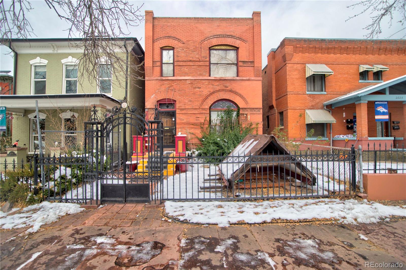 Historic 1888 Victorian Row Home on Stout StreetStep into Denver’s history with this 1888 brick 2.5-story Victorian row home, beautifully preserved and rich with period detail. Located on a tree-lined side of the street just blocks from Downtown, this Landmark-designated property captures the charm and craftsmanship of a bygone era while offering incredible potential for restoration.Inside, discover ornate woodwork, intricate trim, detailed fireplace mantles, and massive pocket doors that showcase the artistry of the Victorian age. The home features three fireplaces, two wood-burning stoves, double staircases, and tall ceilings throughout.The kitchen, located at the back of the home, includes a large mudroom and open pantry — a perfect blend of practicality and old-world charm. A main-level bedroom with a wood-burning stove and a full bath featuring the original clawfoot tub complete the first floor.Upstairs, the primary suite connects to a private living room with fireplace, skylight, and kitchenette, creating a cozy retreat or potential guest quarters. The upper level also features a massive sunroom with a full wall of windows and sliding doors that open to the back deck, flooding the space with light and offering a peaceful spot.Additional highlights include large skylights throughout the upper level, a full basement, a private yard, and a detached oversized garage with alley access. Zoned U-RH-2.5, this property offers flexibility and opportunity for future use.With its ornate woodwork, preserved brick façade, and timeless Victorian character, this home stands as a true piece of Denver’s architectural history — waiting for your vision to bring it to full restoration and glory.