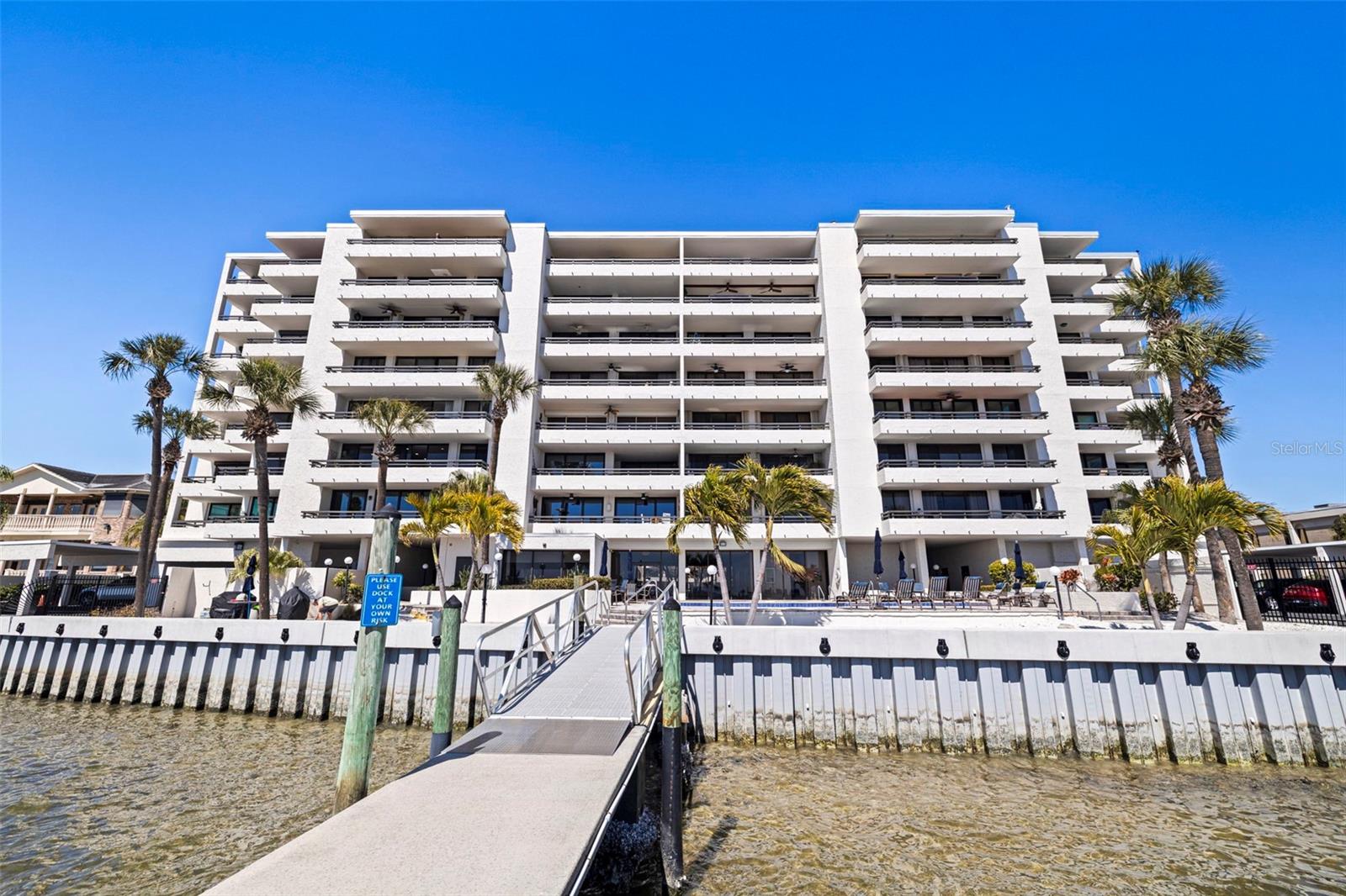 A million-dollar view without the million-dollar price tag. Along the shores of Old Tampa Bay in Beach Park, this fully remodeled two-bedroom, two-bath condominium offers expansive water views and an interior defined by a light and bright palette. The residence has undergone complete renovation including new flooring throughout, new ceilings, new lighting and updated fixtures. Fresh interior paint enhances the clean, neutral aesthetic while eastern exposure fills the home with natural light. Sliding glass doors frame panoramic bay views and connect the open-concept living and dining areas to the private balcony. The kitchen features new quartz countertops, a new range and microwave, and a new full-size stackable washer and dryer. Both baths have been fully remodeled with new tile and updated fixtures. A new heating, ventilation and air conditioning system has been installed, along with new ductwork throughout the residence and added insulation for improved efficiency. Residents enjoy access to community amenities including a waterfront pool, fitness center and marina. Ideally in South Tampa, the property offers convenient access to Tampa International Airport, downtown Tampa, Tampa Riverwalk and nearby shopping and dining destinations.
