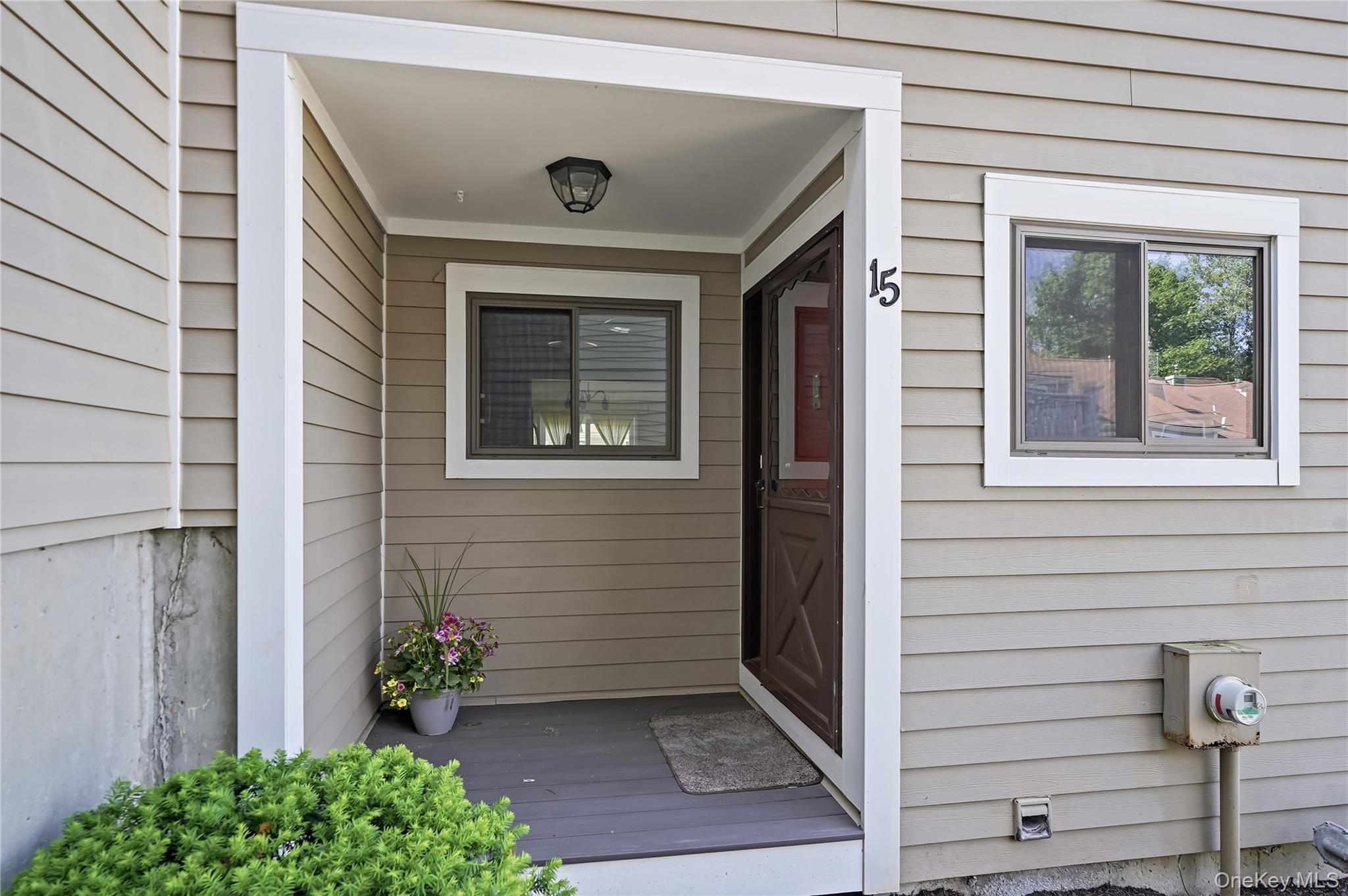 Perfectly positioned at the entrance of the sought-after Brookside Village condominium community within the Bedford Central School District, this 1705 sq ft (inclusive of finished lower level)  tri-level townhome offers comfortable, low-maintenance living in an exceptional location. The main level features a spacious, sun-filled kitchen with maple cabinetry and stainless steel appliances, flowing seamlessly into an expansive dining area and inviting living room complete with a cozy wood-burning fireplace and access to a private Trex deck. Upstairs, you’ll find two generously sized bedrooms, each with its own en-suite bathroom. One bedroom has a large walk in closet. The fully finished lower level, not included in the total square footage, offers a versatile recreation room with two double closets, as well as a separate storage area housing the mechanicals and laundry. Recent updates include new windows and patio slider (2019), deck (2020), hot water heater (2024), and washer and dryer (2022). Residents enjoy access to outstanding community amenities, including an outdoor pool, tennis courts, basketball court, dog park, and picnic area. Ideally located just moments from the vibrant shopping and dining of Mt. Kisco. This home is also exactly one mile from the train station and the Saw Mill Parkway entrance. An unbeatable location offering both convenience and lifestyle!
