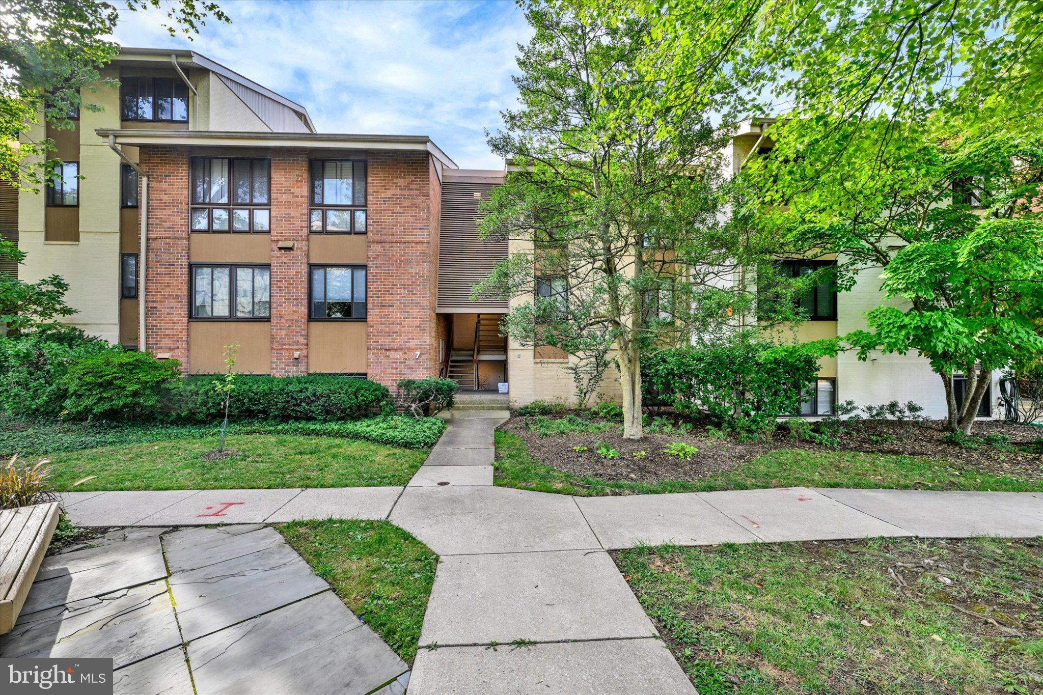 Welcome to this top floor, one bedroom condo offering comfortable living in a gated community with an array of amenities right outside your door. The entryway features hardwood flooring, a coat closet, utility closet, and linen closet currently used as a pantry. The kitchen offers cherry cabinetry, granite countertops, gas cooking, a single sink, and tile flooring, with the dining room just off the kitchen featuring hardwood floors, crown molding, and access to the private balcony. The living room continues with hardwood flooring and crown molding. The spacious bedroom features hardwood flooring, two large windows, and a walk-in closet. A full hall bath offers a white vanity, black countertop, tile flooring, and tub/shower surround. Community laundry facilities and a private storage unit for each residence are located on the lower level. Enjoy the balcony overlooking the nearby school field, providing a pleasant view and plenty of natural light without harsh direct afternoon sun. The gated community offers convenient access to shops, restaurants, pools, doctors, a yoga studio, salon, and a small park. Conveniently located near Whole Foods, additional shopping and dining, private schools, and I-83.